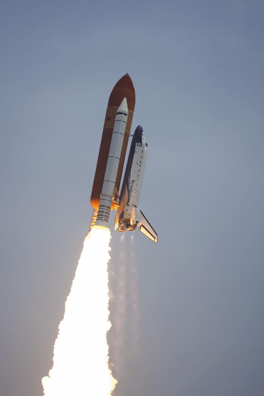 CAPE CANAVERAL, Fla. -- Space shuttle Atlantis completes its roll program moments after liftoff from Launch Pad 39A at NASA's Kennedy Space Center in Florida on its STS-135 mission to the International Space Station. The roll maneuver puts the shuttle in the proper orientation as it heads into space. Atlantis with its crew of four; Commander Chris Ferguson, Pilot Doug Hurley, Mission Specialists Sandy Magnus and Rex Walheim, lifted off at 11:29 a.m. EDT on July 8, 2011 to deliver the Raffaello multi-purpose logistics module packed with supplies and spare parts for the International Space Station. Atlantis also will fly the Robotic Refueling Mission experiment that will investigate the potential for robotically refueling existing satellites in orbit. In addition, Atlantis will return with a failed ammonia pump module to help NASA better understand the failure mechanism and improve pump designs for future systems. STS-135 is the 33rd flight of Atlantis, the 37th shuttle mission to the space station, and the 135th and final mission of NASA's Space Shuttle Program. For more information, visit www.nasa.gov/mission_pages/shuttle/shuttlemissions/sts135/index.html. Photo credit: NASA/ Kenny Allen