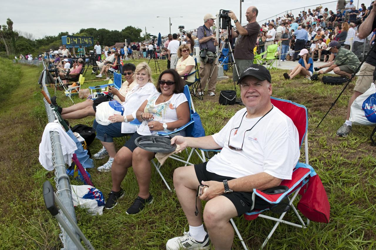 CAPE CANAVERAL, Fla. -- At the Banana River Creek VIP viewing area at NASA's Kennedy Space Center in Florida, spectators relax before the upcoming launch of space shuttle Atlantis on its STS-135 mission to the International Space Station.        Atlantis with its crew of four; Commander Chris Ferguson, Pilot Doug Hurley, Mission Specialists Sandy Magnus and Rex Walheim, lifted off at 11:29 a.m. EDT on July 8, 2011 to deliver the Raffaello multi-purpose logistics module packed with supplies and spare parts for the International Space Station. Atlantis also will fly the Robotic Refueling Mission experiment that will investigate the potential for robotically refueling existing satellites in orbit. In addition, Atlantis will return with a failed ammonia pump module to help NASA better understand the failure mechanism and improve pump designs for future systems. STS-135 is the 33rd flight of Atlantis, the 37th shuttle mission to the space station, and the 135th and final mission of NASA's Space Shuttle Program. For more information, visit www.nasa.gov/mission_pages/shuttle/shuttlemissions/sts135/index.html. Photo credit: NASA/Chad Baumer
