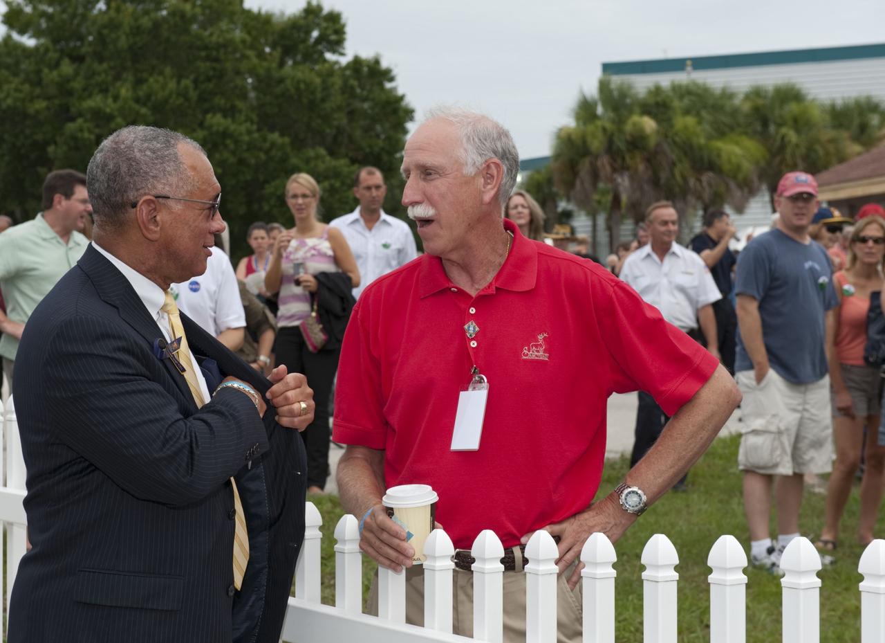 CAPE CANAVERAL, Fla. -- At the Banana River Creek VIP viewing area at NASA's Kennedy Space Center in Florida, NASA Administrator Charles Bolden speaks with former NASA astronaut Richard "Dick" Covey before the upcoming launch of space shuttle Atlantis on its STS-135 mission to the International Space Station. Atlantis with its crew of four; Commander Chris Ferguson, Pilot Doug Hurley, Mission Specialists Sandy Magnus and Rex Walheim, lifted off at 11:29 a.m. EDT on July 8, 2011 to deliver the Raffaello multi-purpose logistics module packed with supplies and spare parts for the International Space Station. Atlantis also will fly the Robotic Refueling Mission experiment that will investigate the potential for robotically refueling existing satellites in orbit. In addition, Atlantis will return with a failed ammonia pump module to help NASA better understand the failure mechanism and improve pump designs for future systems. STS-135 is the 33rd flight of Atlantis, the 37th shuttle mission to the space station, and the 135th and final mission of NASA's Space Shuttle Program. For more information, visit www.nasa.gov/mission_pages/shuttle/shuttlemissions/sts135/index.html. Photo credit: NASA/Chad Baumer