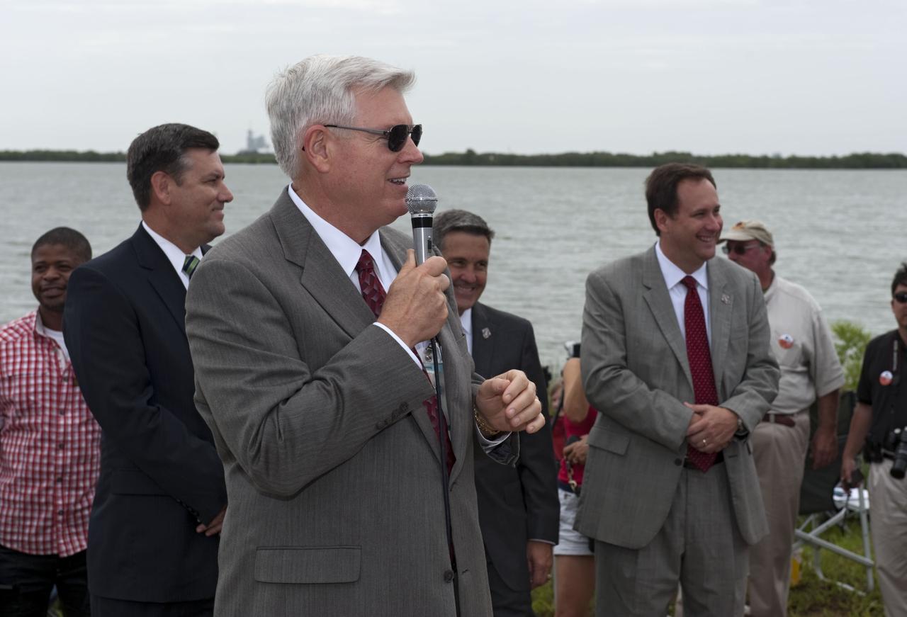 CAPE CANAVERAL, Fla. -- At the Banana River Creek VIP viewing area at NASA's Kennedy Space Center in Florida, Johnson Space Center Director Mike Coats speaks to media and spectators before the launch of space shuttle Atlantis on its STS-135 mission to the International Space Station. Seen also Stennis Space Center Director Patrick Scheuermann (left), Kennedy Center Director Bob Cabana and Marshall Space Flight Center Director Robert Lightfoot. Atlantis with its crew of four; Commander Chris Ferguson, Pilot Doug Hurley, Mission Specialists Sandy Magnus and Rex Walheim, lifted off at 11:29 a.m. EDT on July 8, 2011 to deliver the Raffaello multi-purpose logistics module packed with supplies and spare parts for the International Space Station. Atlantis also will fly the Robotic Refueling Mission experiment that will investigate the potential for robotically refueling existing satellites in orbit. In addition, Atlantis will return with a failed ammonia pump module to help NASA better understand the failure mechanism and improve pump designs for future systems. STS-135 is the 33rd flight of Atlantis, the 37th shuttle mission to the space station, and the 135th and final mission of NASA's Space Shuttle Program. For more information, visit www.nasa.gov/mission_pages/shuttle/shuttlemissions/sts135/index.html. Photo credit: NASA/Chad Baumer