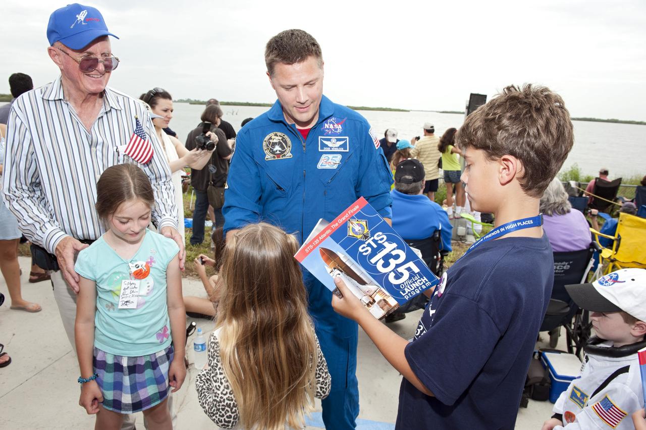 CAPE CANAVERAL, Fla. -- At the Banana River Creek VIP viewing area at NASA's Kennedy Space Center in Florida, youngsters delight in meeting NASA astronaut Doug Wheelock before the launch of space shuttle Atlantis' STS-135 mission to the International Space Station.      Atlantis with its crew of four; Commander Chris Ferguson, Pilot Doug Hurley, Mission Specialists Sandy Magnus and Rex Walheim, lifted off at 11:29 a.m. EDT on July 8, 2011 to deliver the Raffaello multi-purpose logistics module packed with supplies and spare parts for the International Space Station. Atlantis also will fly the Robotic Refueling Mission experiment that will investigate the potential for robotically refueling existing satellites in orbit. In addition, Atlantis will return with a failed ammonia pump module to help NASA better understand the failure mechanism and improve pump designs for future systems. STS-135 is the 33rd flight of Atlantis, the 37th shuttle mission to the space station, and the 135th and final mission of NASA's Space Shuttle Program. For more information, visit www.nasa.gov/mission_pages/shuttle/shuttlemissions/sts135/index.html. Photo credit: NASA/Chad Baumer