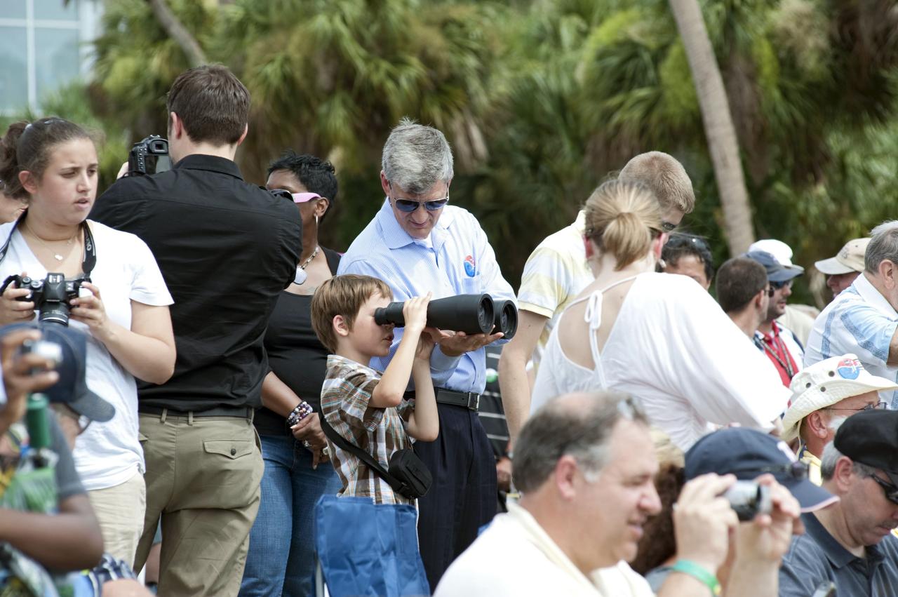 CAPE CANAVERAL, Fla. -- At the Banana River Creek VIP viewing area at NASA's Kennedy Space Center in Florida, spectators relax before the launch of space shuttle Atlantis' STS-135 mission to the International Space Station. Atlantis with its crew of four; Commander Chris Ferguson, Pilot Doug Hurley, Mission Specialists Sandy Magnus and Rex Walheim, lifted off at 11:29 a.m. EDT on July 8, 2011 to deliver the Raffaello multi-purpose logistics module packed with supplies and spare parts for the International Space Station. Atlantis also will fly the Robotic Refueling Mission experiment that will investigate the potential for robotically refueling existing satellites in orbit. In addition, Atlantis will return with a failed ammonia pump module to help NASA better understand the failure mechanism and improve pump designs for future systems. STS-135 is the 33rd flight of Atlantis, the 37th shuttle mission to the space station, and the 135th and final mission of NASA's Space Shuttle Program. For more information, visit www.nasa.gov/mission_pages/shuttle/shuttlemissions/sts135/index.html. Photo credit: NASA/Chad Baumer