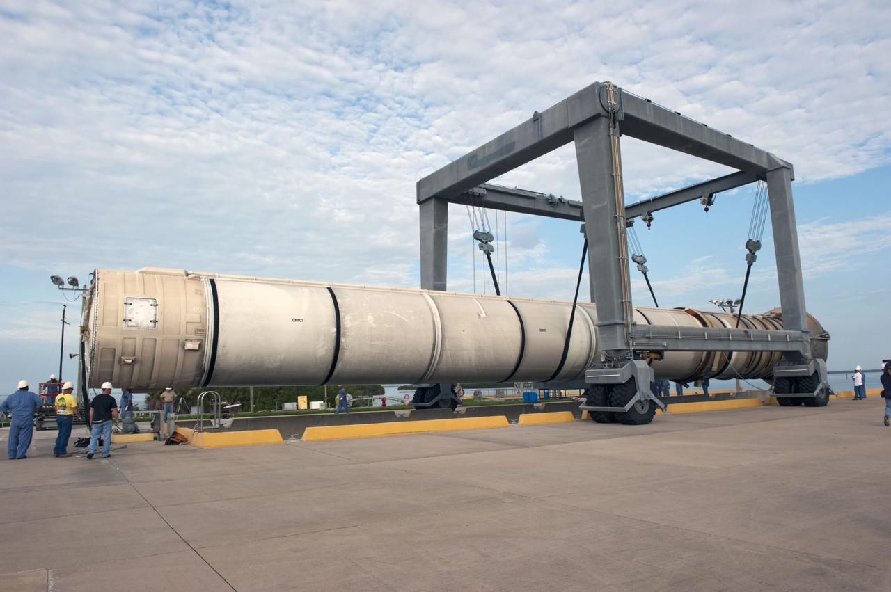 CAPE CANAVERAL, Fla. – One of two solid rocket boosters is lifted above a mooring at Port Canaveral in Florida.  Liberty Star, one of NASA’s two booster retrieval ships, towed the spent booster from space shuttle Atlantis’ final launch to the port. The shuttle’s two solid rocket booster casings and associated flight hardware are recovered in the Atlantic Ocean after every launch by Freedom Star and Liberty Star. The boosters impact the Atlantic about seven minutes after liftoff, and the retrieval ships are stationed about 10 miles from the impact area at the time of splashdown.    After the spent segments are processed, they will be transported to Utah, where they will be deserviced and stored, if needed. Atlantis began its final flight, STS-135, at 11:29 a.m. EDT on July 8 to deliver the Raffaello multi-purpose logistics module packed with supplies and spare parts to the International Space Station. Photo credit: NASA/Kim Shiflett