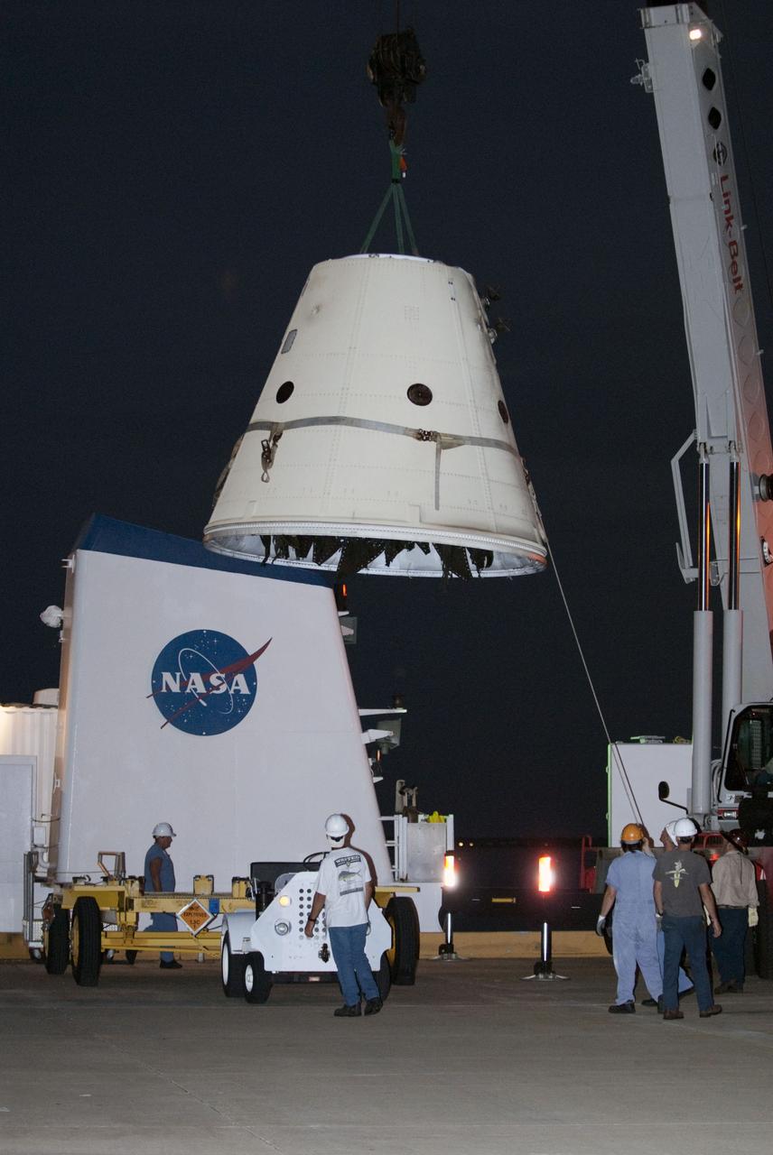 CAPE CANAVERAL, Fla. – A frustum from one of space shuttle Atlantis' two spent solid rocket boosters is lowered toward the dock at Hangar AF at Cape Canaveral Air Force Station in Florida to begin the safing process. The shuttle's two solid rocket booster casings and associated flight hardware are recovered in the Atlantic Ocean after every launch by the booster retrieval ships Freedom Star and Liberty Star. The boosters impact the Atlantic about seven minutes after liftoff and the ships are stationed about 10 miles from the impact area at the time of splashdown. After the spent segments are processed, they will be transported to Utah, where they will be deserviced and stored, if needed. Atlantis began its final flight at 11:29 a.m. EDT on July 8 to deliver the Raffaello multi-purpose logistics module packed with supplies and spare parts for the International Space Station. STS-135 is the 33rd flight of Atlantis, the 37th shuttle mission to the space station, and the 135th and final mission of NASA's Space Shuttle Program. For more information, visit www.nasa.gov/mission_pages/shuttle/shuttlemissions/sts135/index.html. Photo credit: NASA/Kim Shiflett