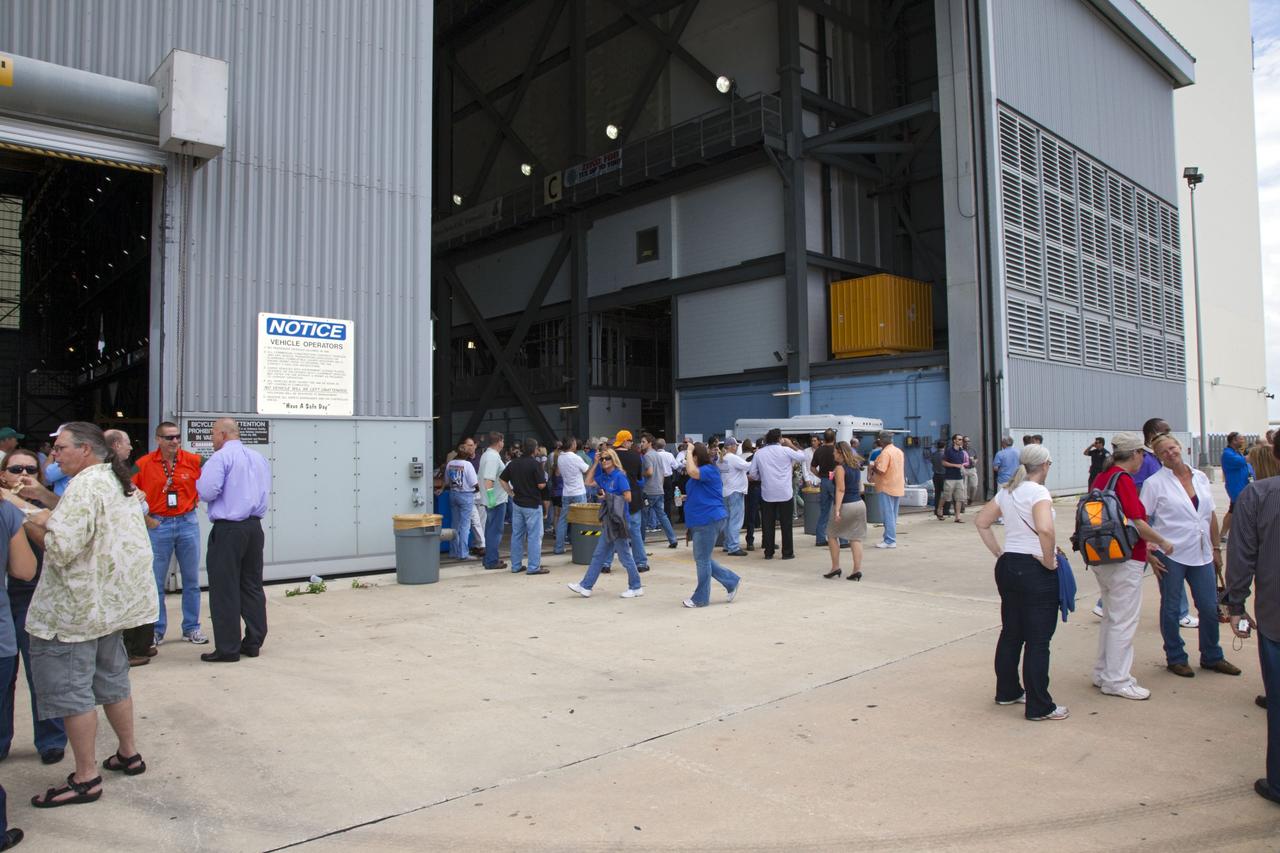 CAPE CANAVERAL, Fla. -- Hundreds of space shuttle workers gather for a party at NASA Kennedy Space Center's Vehicle Assembly Building following the successful liftoff of space shuttle Atlantis on the STS-135 mission, the final flight of the agency's Space Shuttle Program. Atlantis, with its crew of Commander Chris Ferguson, Pilot Doug Hurley, Mission Specialists Sandy Magnus and Rex Walheim, lifted off at 11:29 a.m. EDT on July 8, 2011 to deliver the Raffaello multi-purpose logistics module packed with supplies and spare parts for the International Space Station. For more information, visit www.nasa.gov/mission_pages/shuttle/shuttlemissions/sts135/index.html. Photo credit: NASA/Frankie Martin