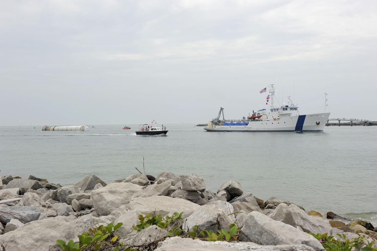 CAPE CANAVERAL, Fla. -- Liberty Star, one of NASA's solid rocket booster retrieval ships, tows the right spent booster from space shuttle Atlantis' final launch, to Port Canaveral in Florida. The shuttle's two solid rocket booster casings and associated flight hardware are recovered in the Atlantic Ocean after every launch by Freedom Star and Liberty Star. The boosters impact the Atlantic about seven minutes after liftoff and the retrieval ships are stationed about 10 miles from the impact area at the time of splashdown. After the spent segments are processed, they will be transported to Utah, where they will be deserviced and stored, if needed. Atlantis began its final flight at 11:29 a.m. EDT on July 8 to deliver the Raffaello multi-purpose logistics module packed with supplies and spare parts for the International Space Station. Atlantis also delivers the Robotic Refueling Mission experiment that will investigate the potential for robotically refueling existing satellites in orbit to the station. In addition, Atlantis will return with a failed ammonia pump module to help NASA better understand the failure mechanism and improve pump designs for future systems. STS-135 is the 33rd flight of Atlantis, the 37th shuttle mission to the space station, and the 135th and final mission of NASA's Space Shuttle Program. For more information, visit www.nasa.gov/mission_pages/shuttle/shuttlemissions/sts135/index.html. Photo credit: NASA/Kim Shiflett