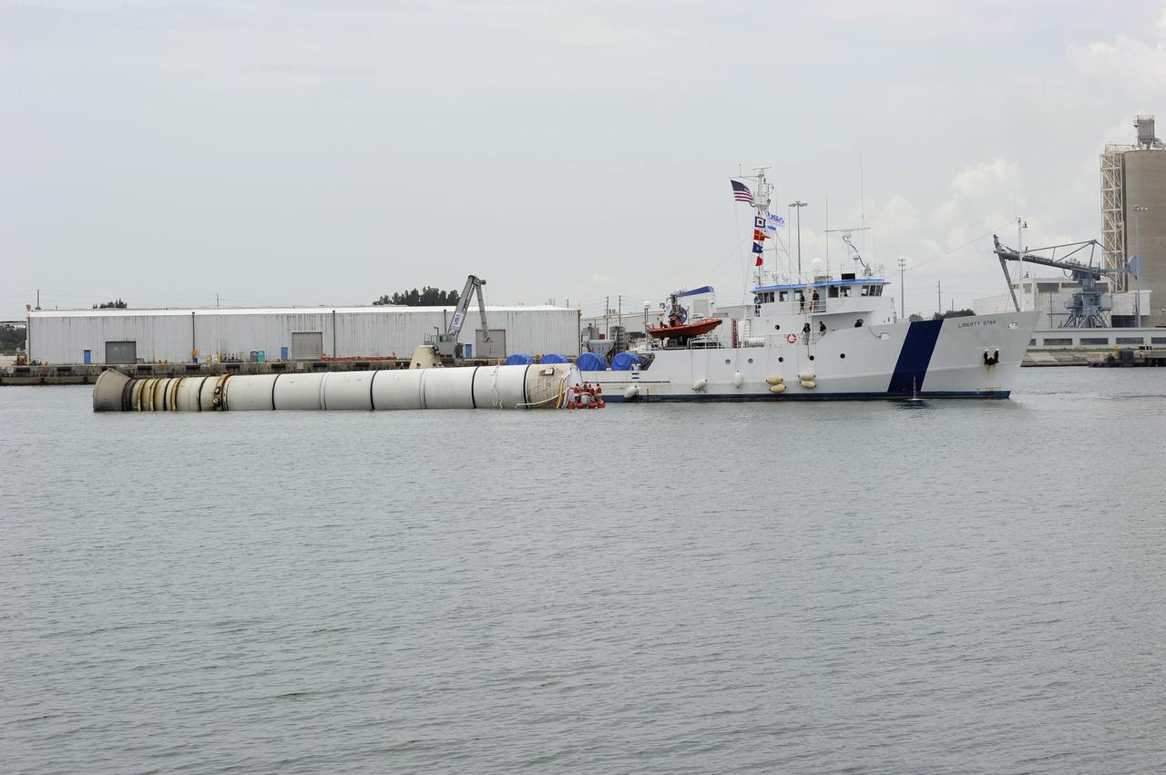 CAPE CANAVERAL, Fla. - Liberty Star, one of NASA's solid rocket booster retrieval ships, maneuvers the right spent booster from space shuttle Atlantis' final launch, as it is taken to Port Canaveral in Florida. The shuttle's two solid rocket booster casings and associated flight hardware are recovered in the Atlantic Ocean after every launch by Freedom Star and Liberty Star. The boosters impact the Atlantic about seven minutes after liftoff and the retrieval ships are stationed about 10 miles from the impact area at the time of splashdown. After the spent segments are processed, they will be transported to Utah, where they will be deserviced and stored, if needed. Atlantis began its final flight at 11:29 a.m. EDT on July 8 to deliver the Raffaello multi-purpose logistics module packed with supplies and spare parts for the International Space Station. Atlantis also delivers the Robotic Refueling Mission experiment that will investigate the potential for robotically refueling existing satellites in orbit to the station. In addition, Atlantis will return with a failed ammonia pump module to help NASA better understand the failure mechanism and improve pump designs for future systems. STS-135 is the 33rd flight of Atlantis, the 37th shuttle mission to the space station, and the 135th and final mission of NASA's Space Shuttle Program. For more information, visit www.nasa.gov/mission_pages/shuttle/shuttlemissions/sts135/index.html. Photo credit: NASA/Kim Shiflett