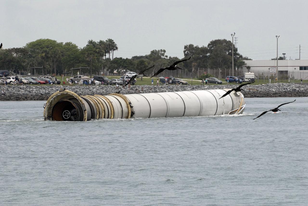 CAPE CANAVERAL, Fla. – The right spent booster from space shuttle Atlantis' final launch is towed by the Liberty Star, one of NASA's solid rocket booster retrieval ships to Port Canaveral in Florida. The shuttle's two solid rocket booster casings and associated flight hardware are recovered in the Atlantic Ocean after every launch by Freedom Star and Liberty Star. The boosters impact the Atlantic about seven minutes after liftoff and the retrieval ships are stationed about 10 miles from the impact area at the time of splashdown. After the spent segments are processed, they will be transported to Utah, where they will be deserviced and stored, if needed. Atlantis began its final flight at 11:29 a.m. EDT on July 8 to deliver the Raffaello multi-purpose logistics module packed with supplies and spare parts for the International Space Station. Atlantis also delivers the Robotic Refueling Mission experiment that will investigate the potential for robotically refueling existing satellites in orbit to the station. In addition, Atlantis will return with a failed ammonia pump module to help NASA better understand the failure mechanism and improve pump designs for future systems. STS-135 is the 33rd flight of Atlantis, the 37th shuttle mission to the space station, and the 135th and final mission of NASA's Space Shuttle Program. For more information, visit www.nasa.gov/mission_pages/shuttle/shuttlemissions/sts135/index.html. Photo credit: NASA/Kim Shiflett