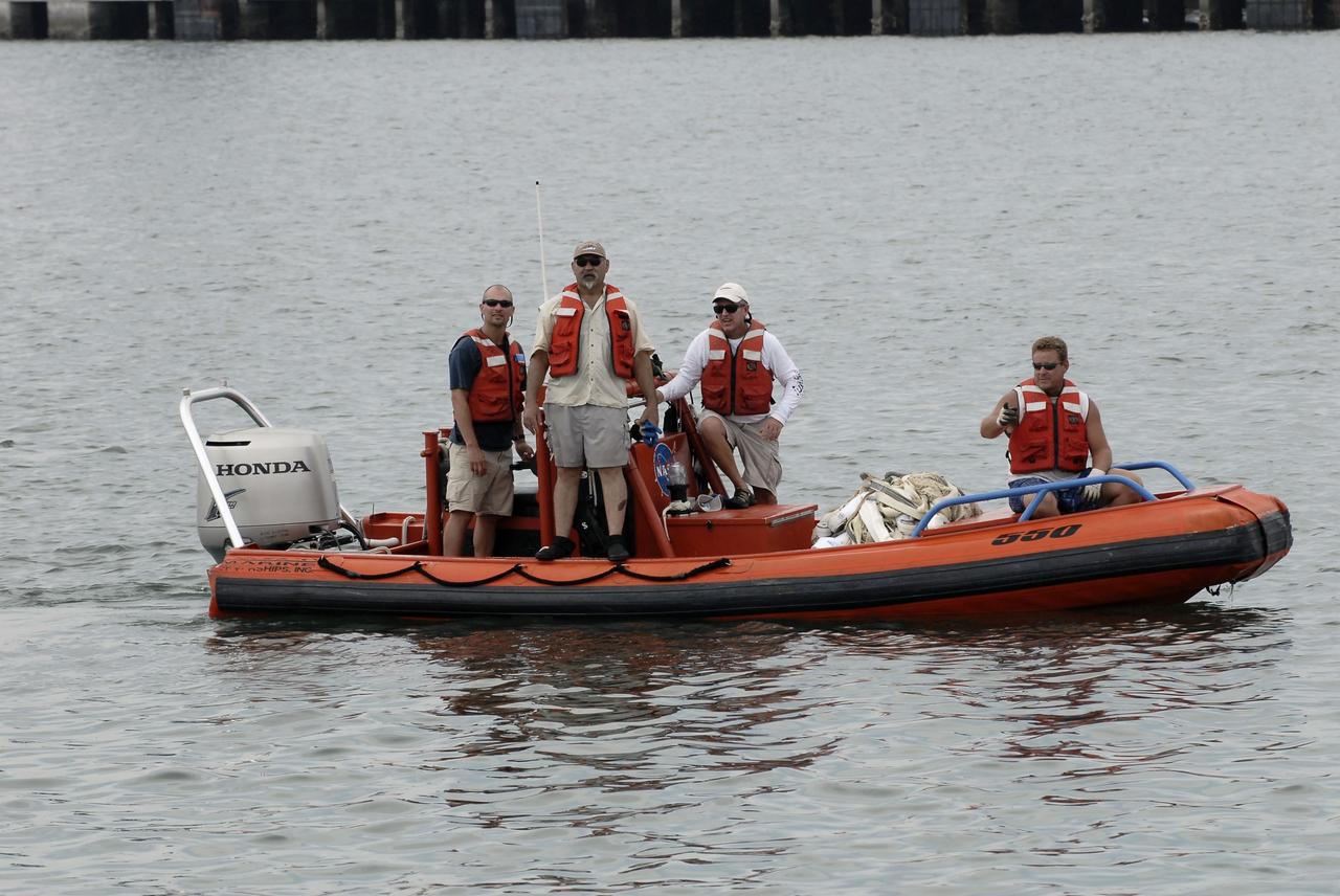 CAPE CANAVERAL, Fla. – A team oversees the return of the right spent booster from space shuttle Atlantis' final to Port Canaveral in Florida. The boat and team are from the Liberty Star, one of NASA's solid rocket booster retrieval ships. The shuttle's two solid rocket booster casings and associated flight hardware are recovered in the Atlantic Ocean after every launch by Freedom Star and Liberty Star. The boosters impact the Atlantic about seven minutes after liftoff and the retrieval ships are stationed about 10 miles from the impact area at the time of splashdown. After the spent segments are processed, they will be transported to Utah, where they will be deserviced and stored, if needed. Atlantis began its final flight at 11:29 a.m. EDT on July 8 to deliver the Raffaello multi-purpose logistics module packed with supplies and spare parts for the International Space Station. Atlantis also delivers the Robotic Refueling Mission experiment that will investigate the potential for robotically refueling existing satellites in orbit to the station. In addition, Atlantis will return with a failed ammonia pump module to help NASA better understand the failure mechanism and improve pump designs for future systems. STS-135 is the 33rd flight of Atlantis, the 37th shuttle mission to the space station, and the 135th and final mission of NASA's Space Shuttle Program. For more information, visit www.nasa.gov/mission_pages/shuttle/shuttlemissions/sts135/index.html. Photo credit: NASA/Kim Shiflett