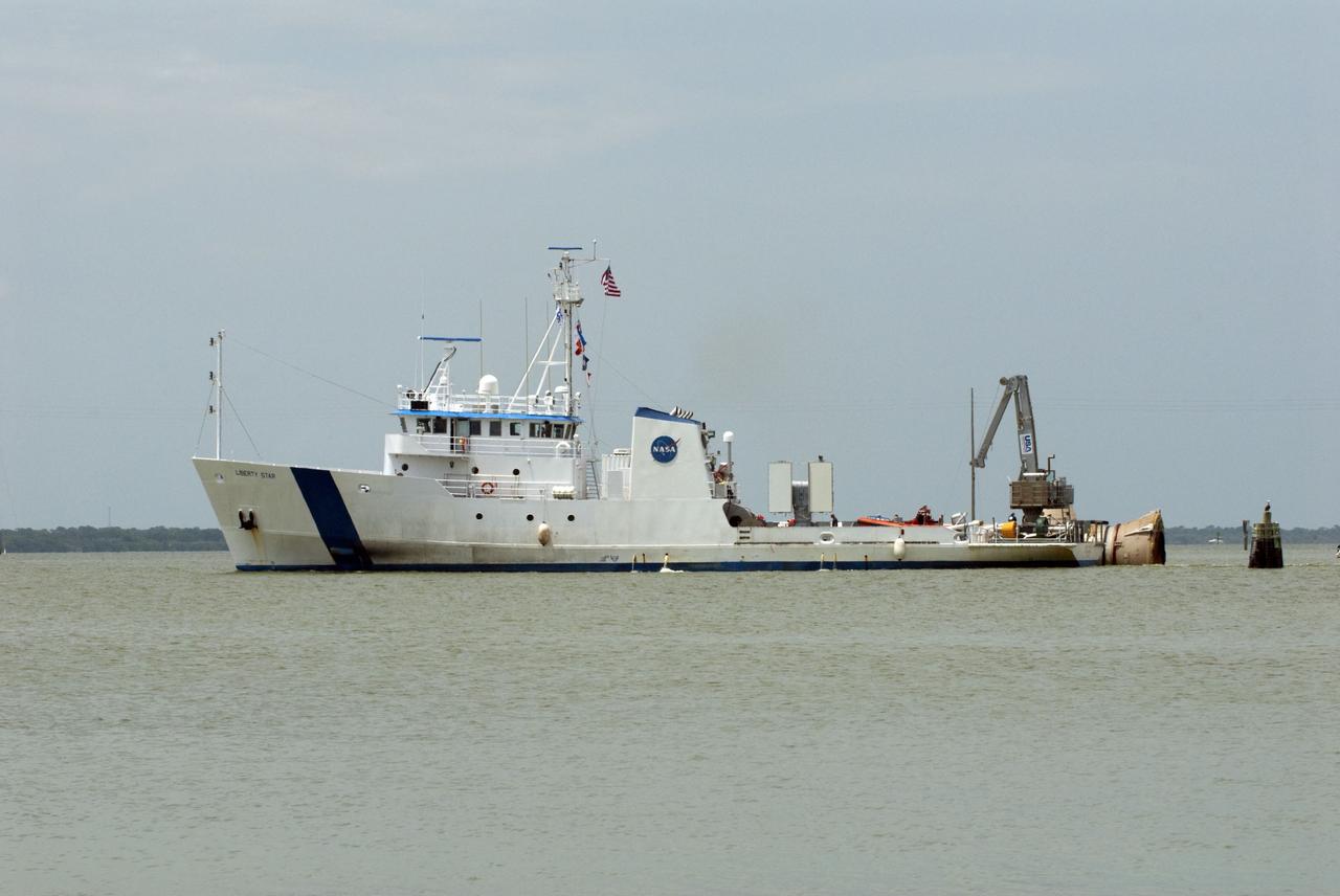 CAPE CANAVERAL, Fla. -- Liberty Star, one of NASA's solid rocket booster retrieval ships, tows the right spent booster from space shuttle Atlantis' final launch, as it is taken to Port Canaveral in Florida. The shuttle's two solid rocket booster casings and associated flight hardware are recovered in the Atlantic Ocean after every launch by Freedom Star and Liberty Star. The boosters impact the Atlantic about seven minutes after liftoff and the retrieval ships are stationed about 10 miles from the impact area at the time of splashdown. After the spent segments are processed, they will be transported to Utah, where they will be deserviced and stored, if needed. Atlantis began its final flight at 11:29 a.m. EDT on July 8 to deliver the Raffaello multi-purpose logistics module packed with supplies and spare parts for the International Space Station. Atlantis also delivers the Robotic Refueling Mission experiment that will investigate the potential for robotically refueling existing satellites in orbit to the station. In addition, Atlantis will return with a failed ammonia pump module to help NASA better understand the failure mechanism and improve pump designs for future systems. STS-135 is the 33rd flight of Atlantis, the 37th shuttle mission to the space station, and the 135th and final mission of NASA's Space Shuttle Program. For more information, visit www.nasa.gov/mission_pages/shuttle/shuttlemissions/sts135/index.html. Photo credit: NASA/Kim Shiflett
