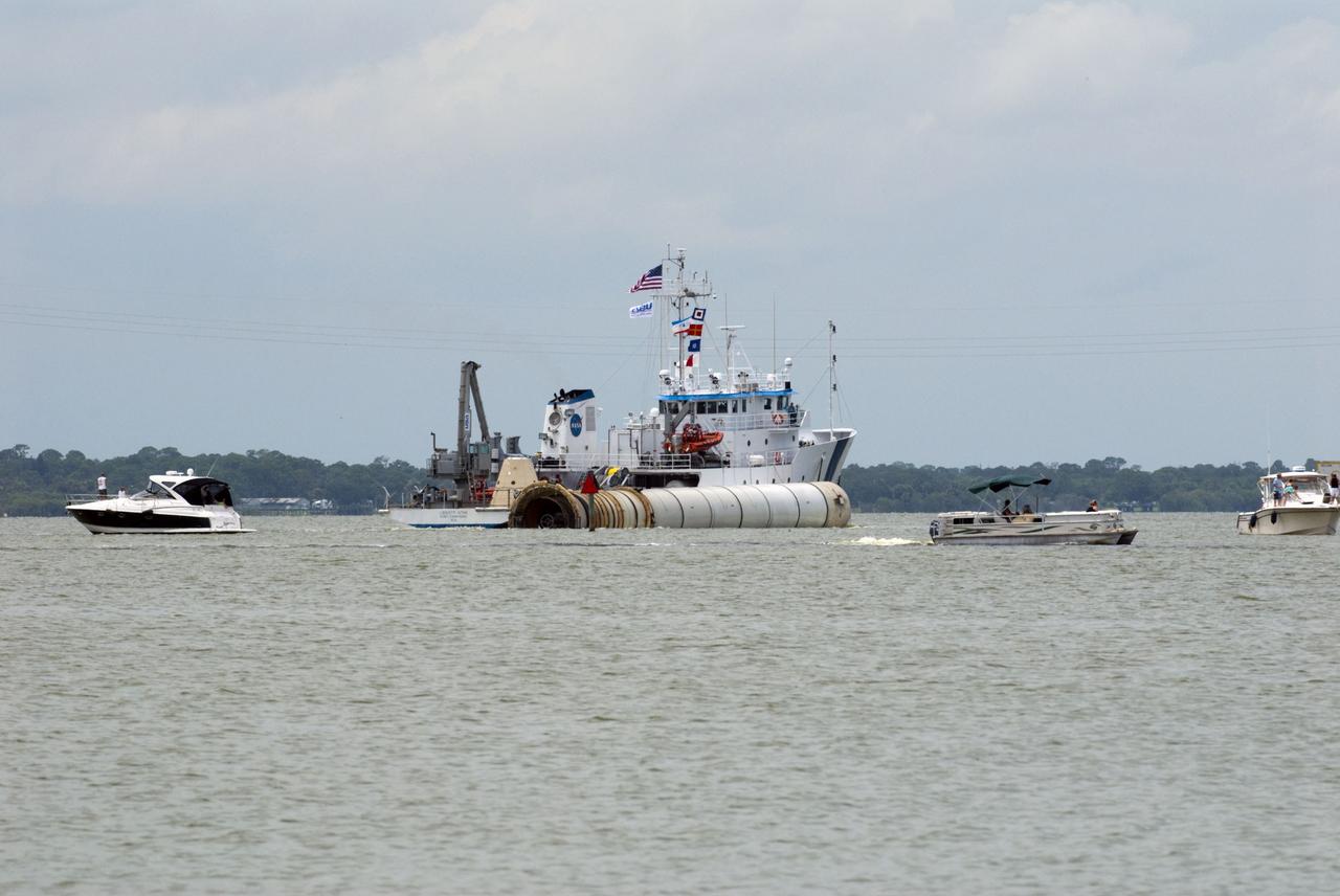 CAPE CANAVERAL, Fla. -- Liberty Star, one of NASA's solid rocket booster retrieval ships, tows the right spent booster from space shuttle Atlantis' final launch, as it is taken to Port Canaveral in Florida. The shuttle's two solid rocket booster casings and associated flight hardware are recovered in the Atlantic Ocean after every launch by Freedom Star and Liberty Star. The boosters impact the Atlantic about seven minutes after liftoff and the retrieval ships are stationed about 10 miles from the impact area at the time of splashdown. After the spent segments are processed, they will be transported to Utah, where they will be deserviced and stored, if needed. Atlantis began its final flight at 11:29 a.m. EDT on July 8 to deliver the Raffaello multi-purpose logistics module packed with supplies and spare parts for the International Space Station. Atlantis also delivers the Robotic Refueling Mission experiment that will investigate the potential for robotically refueling existing satellites in orbit to the station. In addition, Atlantis will return with a failed ammonia pump module to help NASA better understand the failure mechanism and improve pump designs for future systems. STS-135 is the 33rd flight of Atlantis, the 37th shuttle mission to the space station, and the 135th and final mission of NASA's Space Shuttle Program. For more information, visit www.nasa.gov/mission_pages/shuttle/shuttlemissions/sts135/index.html. Photo credit: NASA/Kim Shiflett