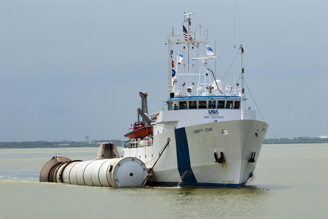 CAPE CANAVERAL, Fla. -- Liberty Star, one of NASA's solid rocket booster retrieval ships, tows the right spent booster from space shuttle Atlantis' final launch, as it is taken to Port Canaveral in Florida. The shuttle's two solid rocket booster casings and associated flight hardware are recovered in the Atlantic Ocean after every launch by Freedom Star and Liberty Star. The boosters impact the Atlantic about seven minutes after liftoff and the retrieval ships are stationed about 10 miles from the impact area at the time of splashdown. After the spent segments are processed, they will be transported to Utah, where they will be deserviced and stored, if needed. Atlantis began its final flight at 11:29 a.m. EDT on July 8 to deliver the Raffaello multi-purpose logistics module packed with supplies and spare parts for the International Space Station. Atlantis also delivers the Robotic Refueling Mission experiment that will investigate the potential for robotically refueling existing satellites in orbit to the station. In addition, Atlantis will return with a failed ammonia pump module to help NASA better understand the failure mechanism and improve pump designs for future systems. STS-135 is the 33rd flight of Atlantis, the 37th shuttle mission to the space station, and the 135th and final mission of NASA's Space Shuttle Program. For more information, visit www.nasa.gov/mission_pages/shuttle/shuttlemissions/sts135/index.html. Photo credit: NASA/Kim Shiflett