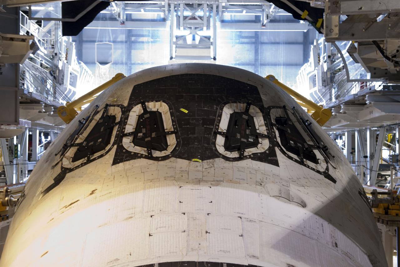 CAPE CANAVERAL, Fla. -- In Orbiter Processing Facility-2, or OPF-2, at NASA's Kennedy Space Center in Florida, the cockpit windows on space shuttle Discovery are covered and secured for its move to the Vehicle Assembly Building, or VAB. Discovery will be stored inside the VAB for approximately one month while shuttle Atlantis undergoes processing in OPF-2 following its final mission, STS-135. Discovery flew its 39th and final mission, STS-133, in February and March 2011, and currently is being prepared for public display at the Smithsonian's National Air and Space Museum Steven F. Udvar-Hazy Center in Virginia. For more information about Discovery's Transition and Retirement, visit www.nasa.gov/mission_pages/shuttle/launch/discovery_rss_collection_archive_1.html. Photo credit: NASA/Jim Grossmann