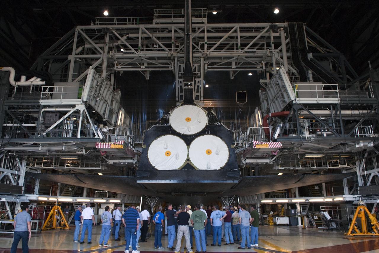 CAPE CANAVERAL, Fla. -- In Orbiter Processing Facility-2, or OPF-2, at NASA's Kennedy Space Center in Florida, workers evaluate space shuttle Discovery's readiness for its move to the Vehicle Assembly Building, or VAB. Discovery will be stored inside the VAB for approximately one month while shuttle Atlantis undergoes processing in OPF-2 following its final mission, STS-135. Discovery flew its 39th and final mission, STS-133, in February and March 2011, and currently is being prepared for public display at the Smithsonian's National Air and Space Museum Steven F. Udvar-Hazy Center in Virginia. For more information about Discovery's Transition and Retirement, visit www.nasa.gov/mission_pages/shuttle/launch/discovery_rss_collection_archive_1.html. Photo credit: NASA/Jim Grossmann