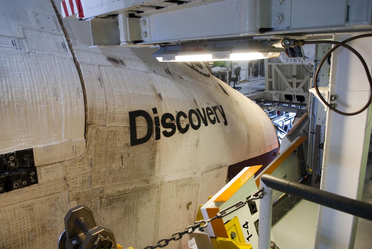 CAPE CANAVERAL, Fla. -- In Orbiter Processing Facility-2, or OPF-2, at NASA's Kennedy Space Center in Florida, blankets covering the frame of space shuttle Discovery show evidence of its 39 successful spaceflights. Discovery will be stored inside the VAB for approximately one month while shuttle Atlantis undergoes processing in OPF-2 following its final mission, STS-135. Discovery flew its 39th and final mission, STS-133, in February and March 2011, and currently is being prepared for public display at the Smithsonian's National Air and Space Museum Steven F. Udvar-Hazy Center in Virginia. For more information about Discovery's Transition and Retirement, visit www.nasa.gov/mission_pages/shuttle/launch/discovery_rss_collection_archive_1.html. Photo credit: NASA/Jim Grossmann