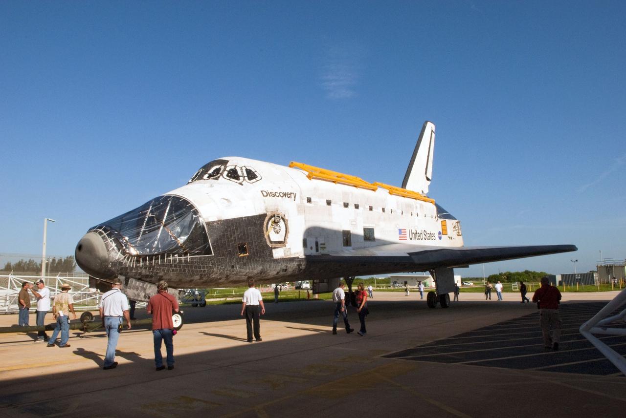 CAPE CANAVERAL, Fla. -- At NASA's Kennedy Space Center in Florida, space shuttle Discovery ventures out in public seemingly "undressed" -- its nose encased in protective plastic, its cockpit windows covered, and strongbacks attached to its payload bay doors. The shuttle is rolling from Orbiter Processing Facility-2, or OPF-2, to the Vehicle Assembly Building, or VAB. Discovery will be stored inside the VAB for approximately one month while shuttle Atlantis undergoes processing in OPF-2 following its final mission, STS-135. Discovery flew its 39th and final mission, STS-133, in February and March 2011, and currently is being prepared for public display at the Smithsonian's National Air and Space Museum Steven F. Udvar-Hazy Center in Virginia. For more information about Discovery's Transition and Retirement, visit www.nasa.gov/mission_pages/shuttle/launch/discovery_rss_collection_archive_1.html. Photo credit: NASA/Jim Grossmann