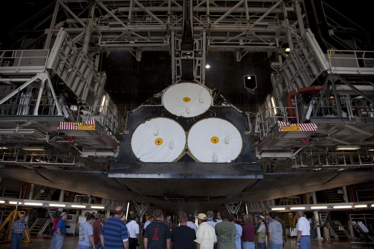 CAPE CANAVERAL, Fla. -- In Orbiter Processing Facility-2, or OPF-2, at NASA's Kennedy Space Center in Florida, workers evaluate space shuttle Discovery's readiness for its move to the Vehicle Assembly Building, or VAB. Discovery will be stored inside the VAB for approximately one month while shuttle Atlantis undergoes processing in OPF-2 following its final mission, STS-135. Discovery flew its 39th and final mission, STS-133, in February and March 2011, and currently is being prepared for public display at the Smithsonian's National Air and Space Museum Steven F. Udvar-Hazy Center in Virginia. For more information about Discovery's Transition and Retirement, visit www.nasa.gov/mission_pages/shuttle/launch/discovery_rss_collection_archive_1.html. Photo credit: NASA/Frankie Martin