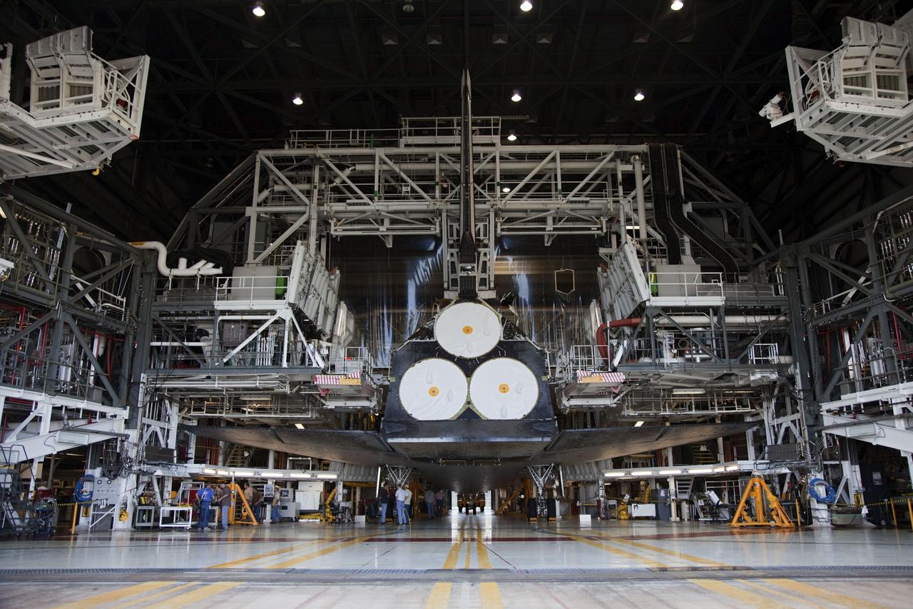 CAPE CANAVERAL, Fla. -- In Orbiter Processing Facility-2, or OPF-2, at NASA's Kennedy Space Center in Florida, work platforms fold away from space shuttle Discovery for its move to the Vehicle Assembly Building, or VAB. Discovery will be stored inside the VAB for approximately one month while shuttle Atlantis undergoes processing in OPF-2 following its final mission, STS-135. Discovery flew its 39th and final mission, STS-133, in February and March 2011, and currently is being prepared for public display at the Smithsonian's National Air and Space Museum Steven F. Udvar-Hazy Center in Virginia. For more information about Discovery's Transition and Retirement, visit www.nasa.gov/mission_pages/shuttle/launch/discovery_rss_collection_archive_1.html. Photo credit: NASA/Frankie Martin
