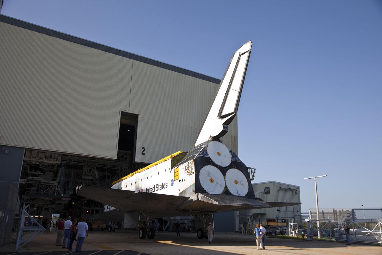 CAPE CANAVERAL, Fla. -- At NASA's Kennedy Space Center in Florida, space shuttle Discovery backs out of Orbiter Processing Facility-2, or OPF-2, to begin the move to the Vehicle Assembly Building, or VAB. Discovery will be stored inside the VAB for approximately one month while shuttle Atlantis undergoes processing in OPF-2 following its final mission, STS-135. Discovery flew its 39th and final mission, STS-133, in February and March 2011, and currently is being prepared for public display at the Smithsonian's National Air and Space Museum Steven F. Udvar-Hazy Center in Virginia. For more information about Discovery's Transition and Retirement, visit www.nasa.gov/mission_pages/shuttle/launch/discovery_rss_collection_archive_1.html. Photo credit: NASA/Frankie Martin