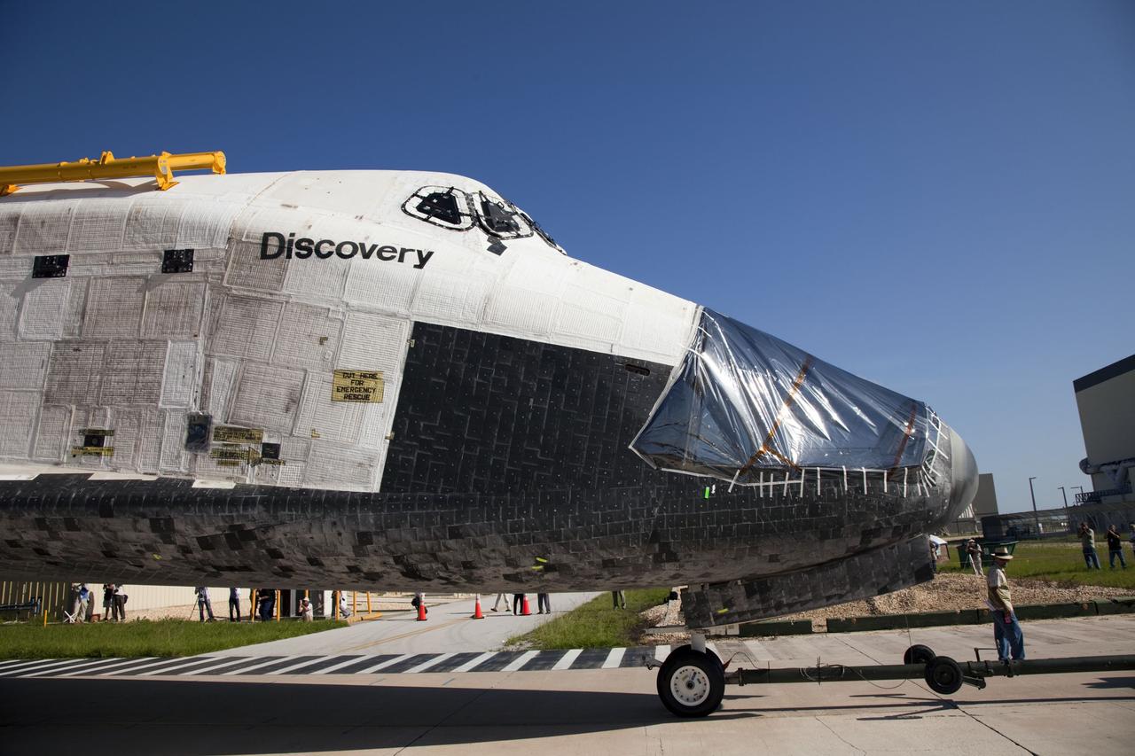 CAPE CANAVERAL, Fla. -- At NASA's Kennedy Space Center in Florida, protective plastic covers the nose of space shuttle Discovery where its forward reaction control system (FRCS) once resided as it rolls from Orbiter Processing Facility-2, or OPF-2, to the Vehicle Assembly Building, or VAB. Discovery's FRCS was removed and shipped to White Sands Space Harbor in New Mexico for a full cleaning and deservicing before it is returned to Kennedy and reinstalled. Discovery will be stored inside the VAB for approximately one month while shuttle Atlantis undergoes processing in OPF-2 following its final mission, STS-135. Discovery flew its 39th and final mission, STS-133, in February and March 2011, and currently is being prepared for public display at the Smithsonian's National Air and Space Museum Steven F. Udvar-Hazy Center in Virginia. For more information about Discovery's Transition and Retirement, visit www.nasa.gov/mission_pages/shuttle/launch/discovery_rss_collection_archive_1.html. Photo credit: NASA/Frankie Martin