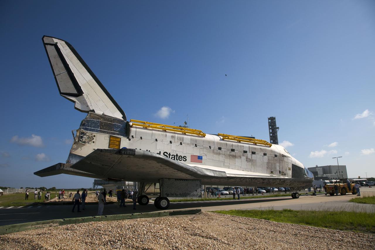 CAPE CANAVERAL, Fla. -- At NASA's Kennedy Space Center in Florida, space shuttle Discovery -- its nose encased in protective plastic, its cockpit windows covered, and strongbacks attached to its payload bay doors -- winds its way from Orbiter Processing Facility-2, or OPF-2, to the Vehicle Assembly Building, or VAB. Discovery will be stored inside the VAB for approximately one month while shuttle Atlantis undergoes processing in OPF-2 following its final mission, STS-135. Discovery flew its 39th and final mission, STS-133, in February and March 2011, and currently is being prepared for public display at the Smithsonian's National Air and Space Museum Steven F. Udvar-Hazy Center in Virginia. For more information about Discovery's Transition and Retirement, visit www.nasa.gov/mission_pages/shuttle/launch/discovery_rss_collection_archive_1.html. Photo credit: NASA/Frankie Martin