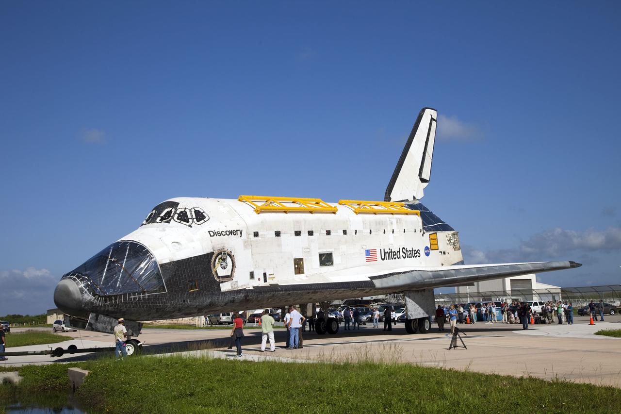CAPE CANAVERAL, Fla. -- At NASA's Kennedy Space Center in Florida, space shuttle Discovery -- its nose encased in protective plastic, its cockpit windows covered, and strongbacks attached to its payload bay doors -- has arrived at the door of the Vehicle Assembly Building, or VAB, from Orbiter Processing Facility-2, or OPF-2. Discovery will be stored inside the VAB for approximately one month while shuttle Atlantis undergoes processing in OPF-2 following its final mission, STS-135. Discovery flew its 39th and final mission, STS-133, in February and March 2011, and currently is being prepared for public display at the Smithsonian's National Air and Space Museum Steven F. Udvar-Hazy Center in Virginia. For more information about Discovery's Transition and Retirement, visit www.nasa.gov/mission_pages/shuttle/launch/discovery_rss_collection_archive_1.html. Photo credit: NASA/Frankie Martin