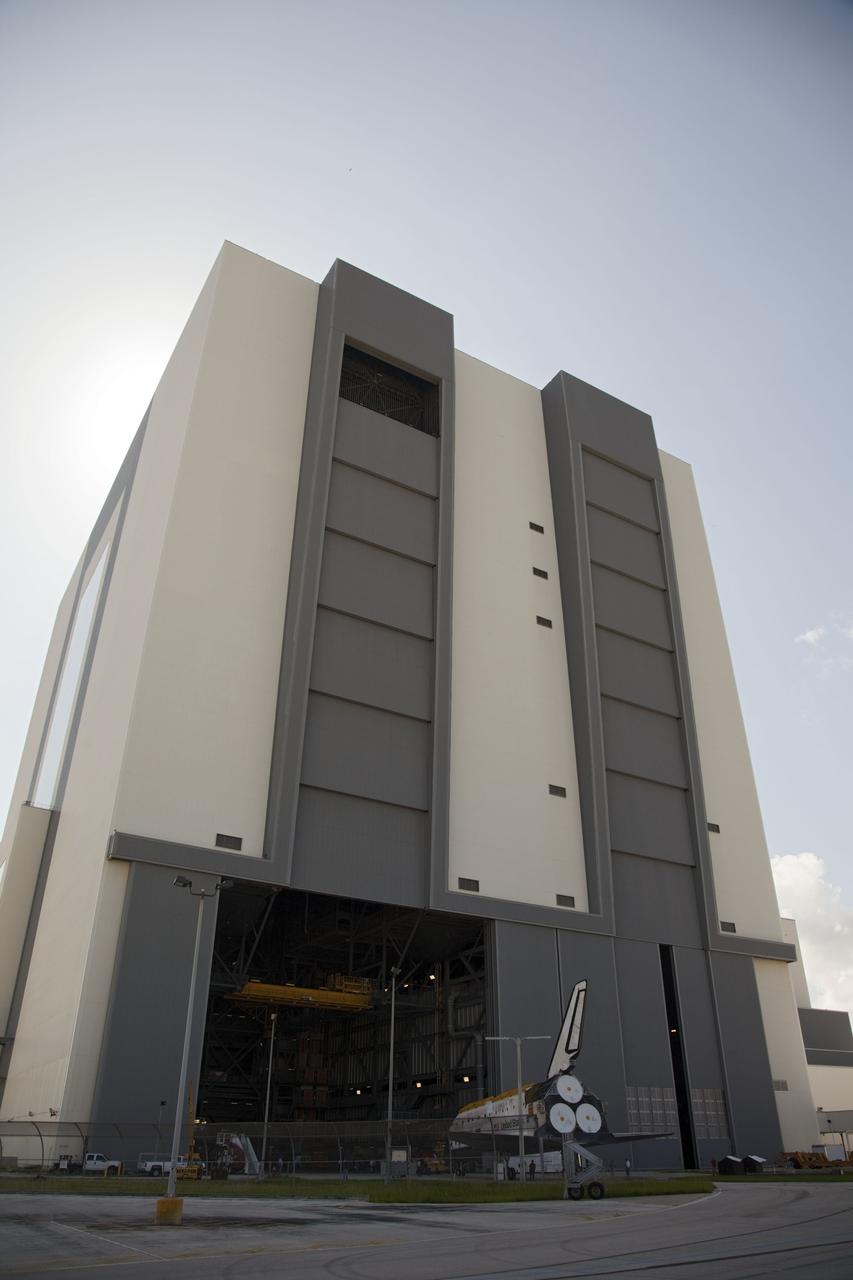 CAPE CANAVERAL, Fla. -- At NASA's Kennedy Space Center in Florida, space shuttle Discovery enters the Vehicle Assembly Building, or VAB, after rolling from Orbiter Processing Facility-2, or OPF-2. Discovery will be stored inside the VAB for approximately one month while shuttle Atlantis undergoes processing in OPF-2 following its final mission, STS-135. Discovery flew its 39th and final mission, STS-133, in February and March 2011, and currently is being prepared for public display at the Smithsonian's National Air and Space Museum Steven F. Udvar-Hazy Center in Virginia. For more information about Discovery's Transition and Retirement, visit www.nasa.gov/mission_pages/shuttle/launch/discovery_rss_collection_archive_1.html. Photo credit: NASA/Frankie Martin