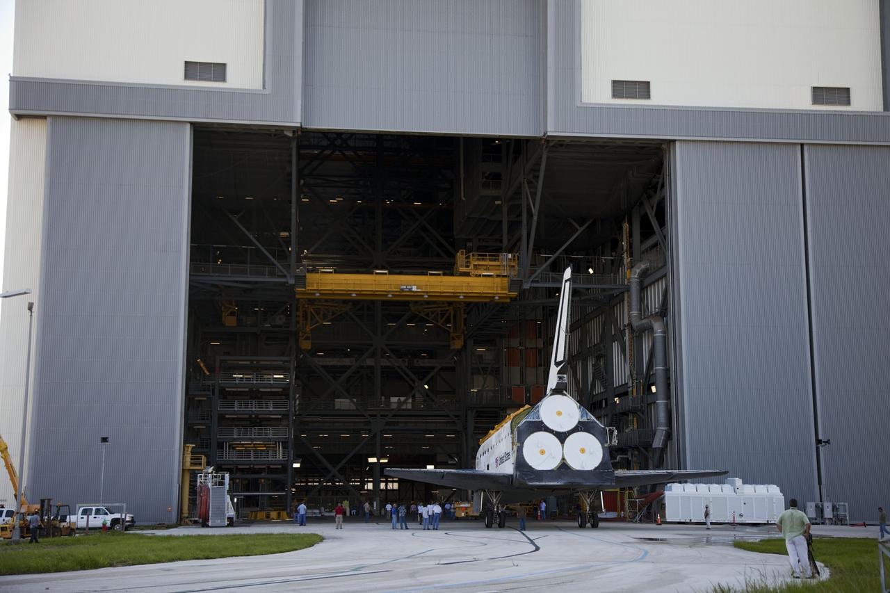 CAPE CANAVERAL, Fla. -- At NASA's Kennedy Space Center in Florida, space shuttle Discovery is welcomed into the Vehicle Assembly Building, or VAB, after rolling from Orbiter Processing Facility-2, or OPF-2. Discovery will be stored inside the VAB for approximately one month while shuttle Atlantis undergoes processing in OPF-2 following its final mission, STS-135. Discovery flew its 39th and final mission, STS-133, in February and March 2011, and currently is being prepared for public display at the Smithsonian's National Air and Space Museum Steven F. Udvar-Hazy Center in Virginia. For more information about Discovery's Transition and Retirement, visit www.nasa.gov/mission_pages/shuttle/launch/discovery_rss_collection_archive_1.html. Photo credit: NASA/Frankie Martin