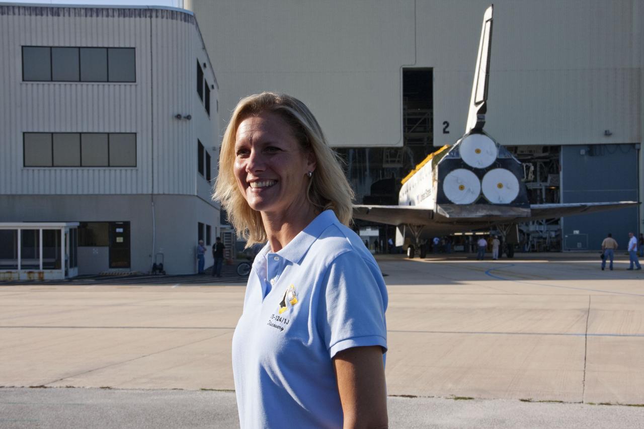 CAPE CANAVERAL, Fla. -- Outside Orbiter Processing Facility-2, or OPF-2, at NASA's Kennedy Space Center in Florida, Stephanie Stilson, Transition and Retirement orbiter flow director, answers questions from the media during the move of space shuttle Discovery to the Vehicle Assembly Building, or VAB.    Discovery will be stored inside the VAB for approximately one month while shuttle Atlantis undergoes processing in OPF-2 following its final mission, STS-135. Discovery flew its 39th and final mission, STS-133, in February and March 2011, and currently is being prepared for public display at the Smithsonian's National Air and Space Museum Steven F. Udvar-Hazy Center in Virginia. For more information about Discovery's Transition and Retirement, visit   www.nasa.gov/mission_pages/shuttle/launch/discovery_rss_collection_archive_1.html.  Photo credit: NASA/Ken Thornsley