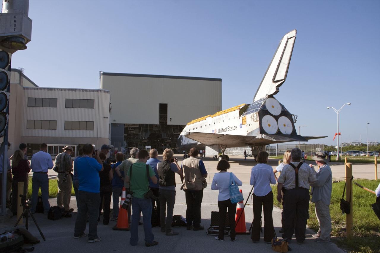 CAPE CANAVERAL, Fla. -- Outside Orbiter Processing Facility-2, or OPF-2, at NASA's Kennedy Space Center in Florida, media are on hand to cover the move of space shuttle Discovery to the Vehicle Assembly Building, or VAB. Discovery will be stored inside the VAB for approximately one month while shuttle Atlantis undergoes processing in OPF-2 following its final mission, STS-135. Discovery flew its 39th and final mission, STS-133, in February and March 2011, and currently is being prepared for public display at the Smithsonian's National Air and Space Museum Steven F. Udvar-Hazy Center in Virginia. For more information about Discovery's Transition and Retirement, visit www.nasa.gov/mission_pages/shuttle/launch/discovery_rss_collection_archive_1.html. Photo credit: NASA/Ken Thornsley