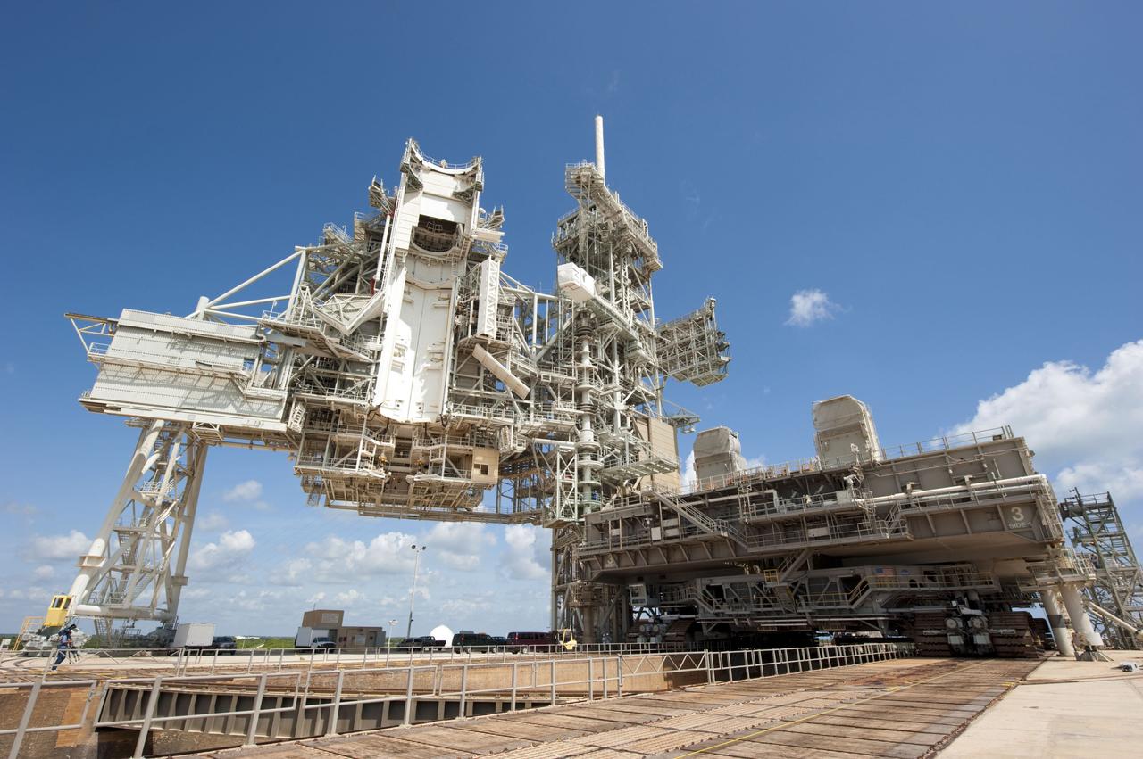 CAPE CANAVERAL, Fla. -- At NASA's Kennedy Space Center in Florida, Mobile Launcher Platform-3 (MLP), which supported space shuttle Atlantis for its final flight to the International Space Station on the STS-135 mission, is being prepared for its last journey from Launch Pad 39A to the Vehicle Assembly Building (VAB). Here, workers have moved a massive crawler-transporter under the MLP -- the last mobile launcher platform to launch a shuttle.                     For more than 40 years, the MLPs have traveled between the massive VAB to both launch pads at Launch Complex 39, and then returned to the VAB for future use. MLP-3 was first used to launch Columbia on the STS-32 mission on Jan. 9, 1990. Photo credit: NASA/Kim Shiflett