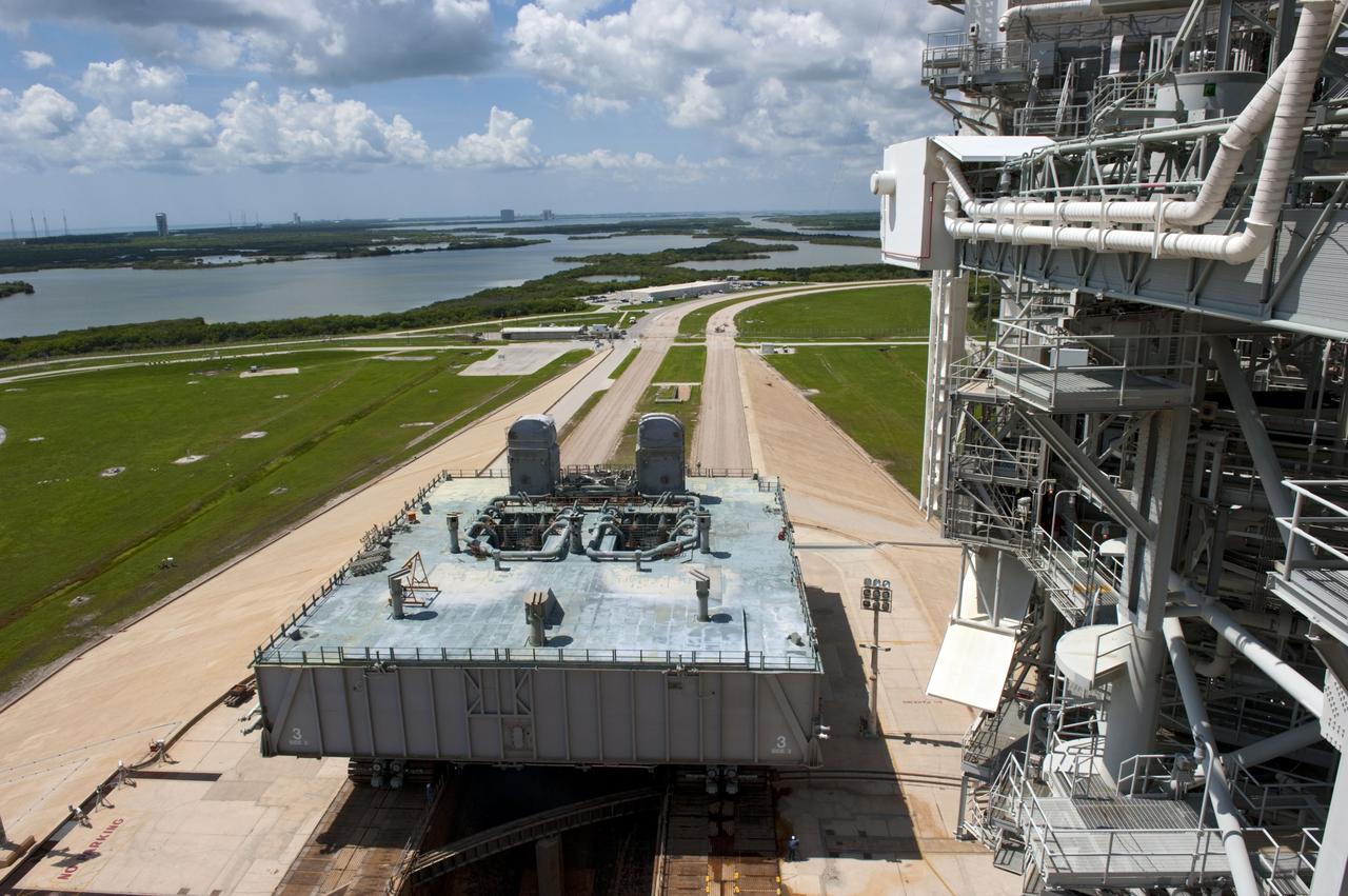 CAPE CANAVERAL, Fla. -- At NASA's Kennedy Space Center in Florida, Mobile Launcher Platform-3 (MLP), which supported space shuttle Atlantis for its final flight to the International Space Station on the STS-135 mission, is taking its last journey from Launch Pad 39A to the Vehicle Assembly Building (VAB). A massive crawler-transporter positioned under the MLP -- the last mobile launcher platform to launch a shuttle, begins the trek back to the VAB.                  For more than 40 years, the MLPs have traveled between the massive VAB to both launch pads at Launch Complex 39, and then returned to the VAB for future use. MLP-3 was first used to launch Columbia on the STS-32 mission on Jan. 9, 1990. Photo credit: NASA/Kim Shiflett