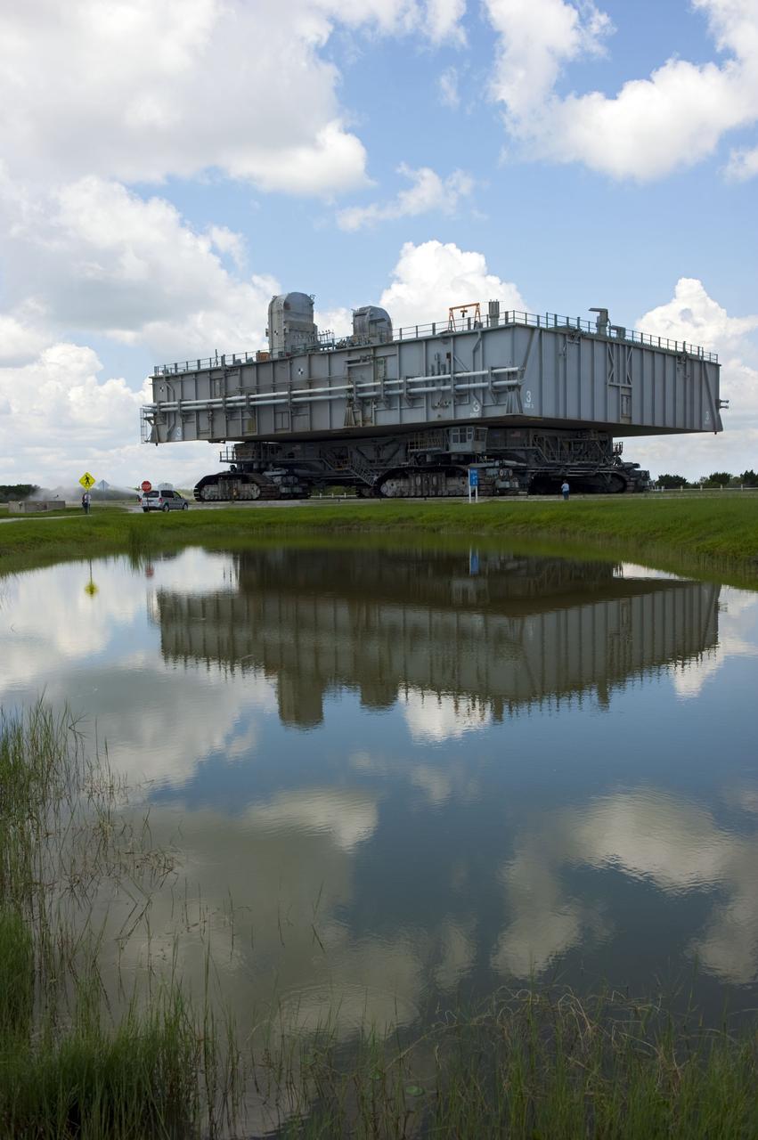 CAPE CANAVERAL, Fla. -- At NASA's Kennedy Space Center in Florida, Mobile Launcher Platform-3 (MLP), which supported space shuttle Atlantis for its final flight to the International Space Station on the STS-135 mission, is taking its last journey from Launch Pad 39A to the Vehicle Assembly Building (VAB). A massive crawler-transporter positioned under the MLP -- the last mobile launcher platform to launch a shuttle, begins the trek back to the VAB.                    For more than 40 years, the MLPs have traveled between the massive VAB to both launch pads at Launch Complex 39, and then returned to the VAB for future use. MLP-3 was first used to launch Columbia on the STS-32 mission on Jan. 9, 1990. Photo credit: NASA/Kim Shiflett