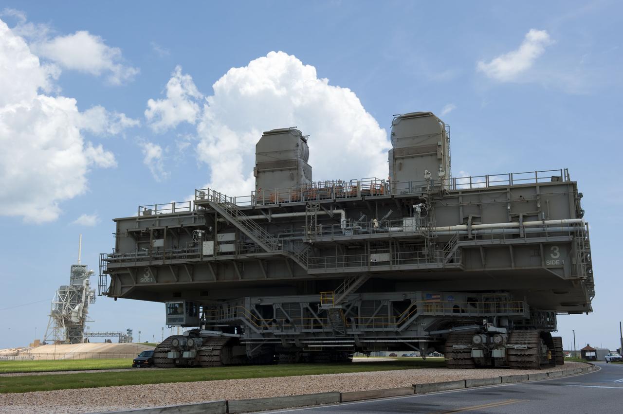 CAPE CANAVERAL, Fla. -- At NASA's Kennedy Space Center in Florida, Mobile Launcher Platform-3 (MLP), which supported space shuttle Atlantis for its final flight to the International Space Station on the STS-135 mission, is taking its last journey from Launch Pad 39A to the Vehicle Assembly Building (VAB). A massive crawler-transporter positioned under the MLP -- the last mobile launcher platform to launch a shuttle, begins the trek back to the VAB.                    For more than 40 years, the MLPs have traveled between the massive VAB to both launch pads at Launch Complex 39, and then returned to the VAB for future use. MLP-3 was first used to launch Columbia on the STS-32 mission on Jan. 9, 1990. Photo credit: NASA/Kim Shiflett