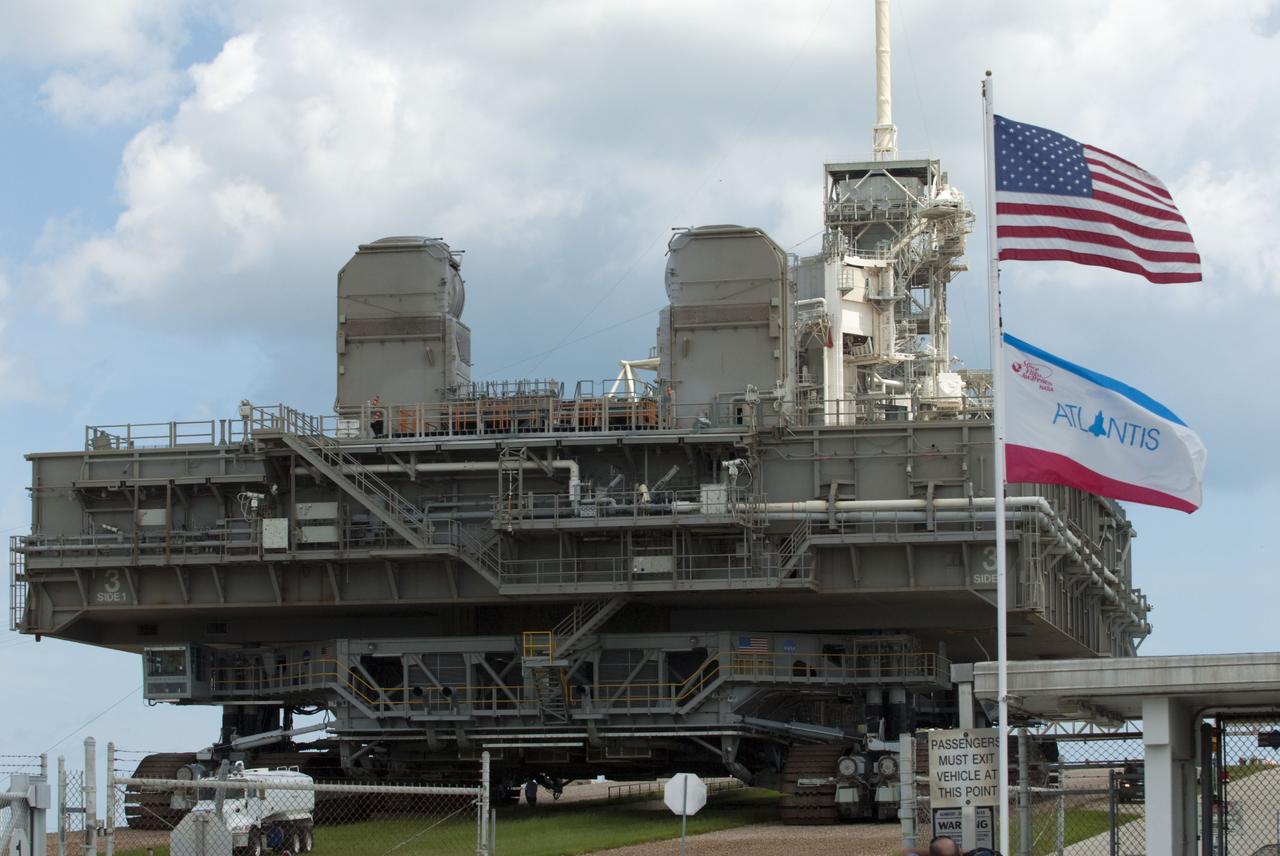 CAPE CANAVERAL, Fla. -- At NASA's Kennedy Space Center in Florida, Mobile Launcher Platform-3 (MLP), which supported space shuttle Atlantis for its final flight to the International Space Station on the STS-135 mission, is taking its last journey from Launch Pad 39A to the Vehicle Assembly Building (VAB). A massive crawler-transporter positioned under the MLP -- the last mobile launcher platform to launch a shuttle, begins the trek back to the VAB.           For more than 40 years, the MLPs have traveled between the massive VAB to both launch pads at Launch Complex 39, and then returned to the VAB for future use. MLP-3 was first used to launch Columbia on the STS-32 mission on Jan. 9, 1990. Photo credit: NASA/Kim Shiflett