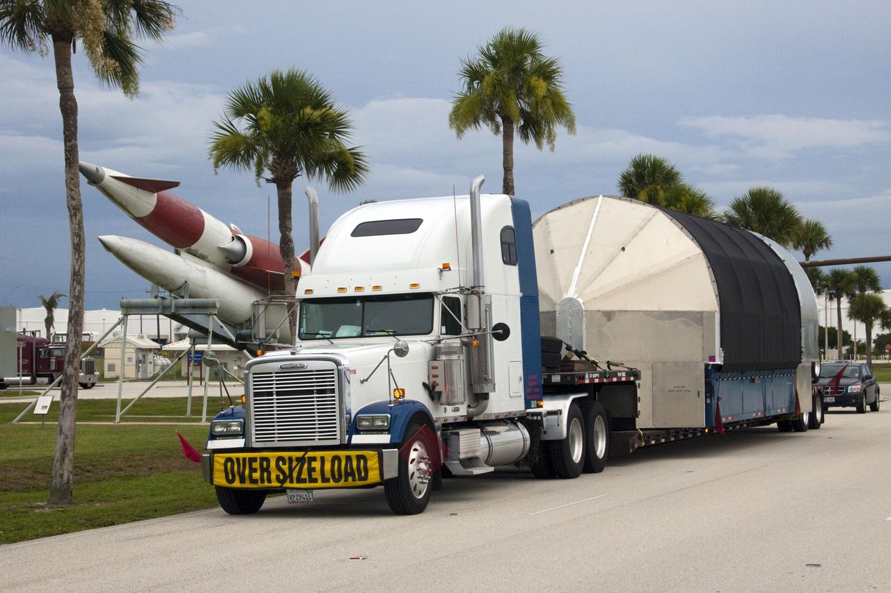 CAPE CANAVERAL, Fla. -- The second stage for the Space Exploration Technologies Corp., or SpaceX, Falcon 9 rocket is transported to the SpaceX hangar at Pad 40 at Cape Canaveral Air Force Station in Florida.             The Falcon 9 rocket will launch a second Dragon spacecraft, called Dragon C2, in late 2011. The mission will demonstrate proximity operations during an approach within six miles of the International Space Station. The company is building the Dragon to fly on resupply missions to the station. SpaceX was awarded procurement for three demonstration flights under the Commercial Orbital Transportation Services, or COTS, program managed by NASA's Johnson Space Center in Houston. The SpaceX contract provides for 12 missions to resupply the station from 2011 through 2015. Photo credit: NASA/Jim Grossmann