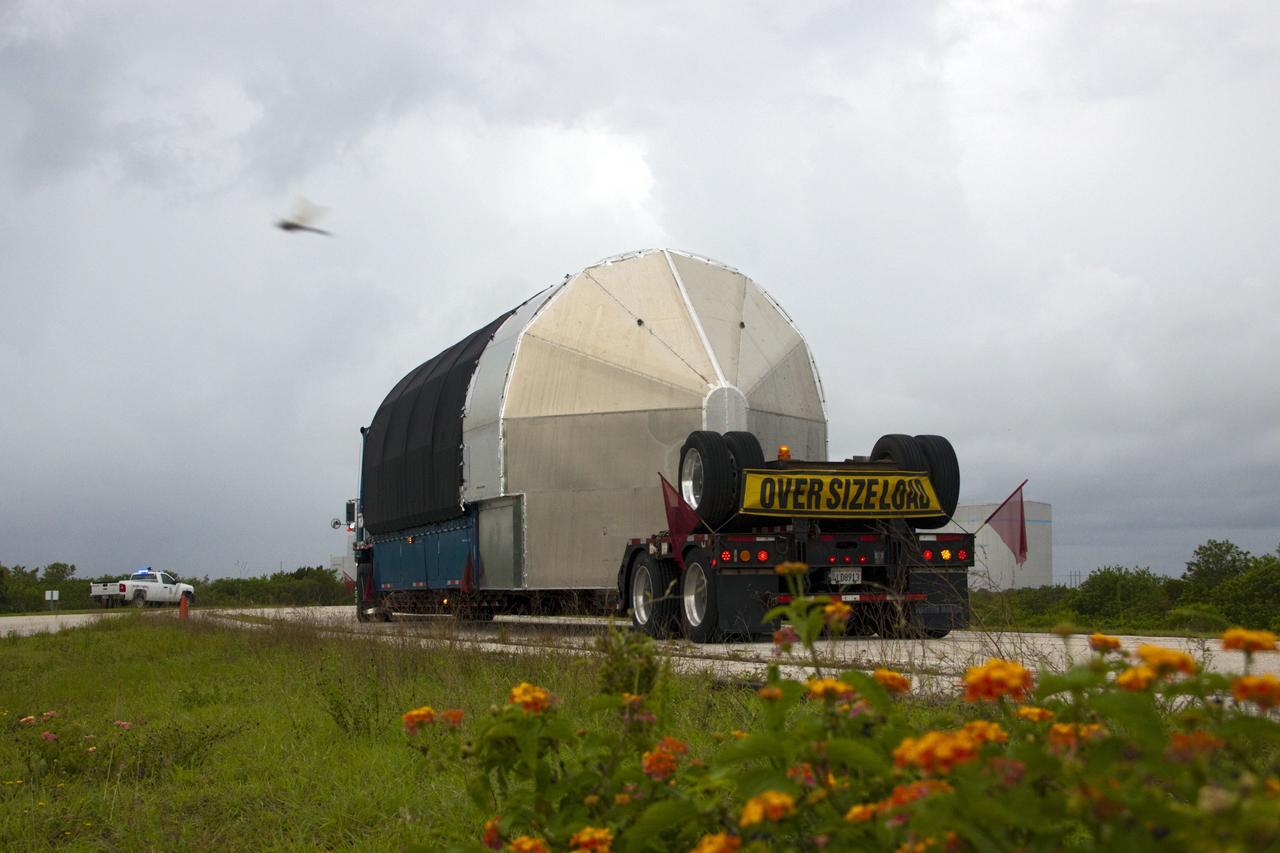 CAPE CANAVERAL, Fla. -- The second stage for the Space Exploration Technologies Corp., or SpaceX, Falcon 9 rocket is transported to the SpaceX hangar at Pad 40 at Cape Canaveral Air Force Station in Florida.             The Falcon 9 rocket will launch a second Dragon spacecraft, called Dragon C2, in late 2011. The mission will demonstrate proximity operations during an approach within six miles of the International Space Station. The company is building the Dragon to fly on resupply missions to the station. SpaceX was awarded procurement for three demonstration flights under the Commercial Orbital Transportation Services, or COTS, program managed by NASA's Johnson Space Center in Houston. The SpaceX contract provides for 12 missions to resupply the station from 2011 through 2015. Photo credit: NASA/Jim Grossmann