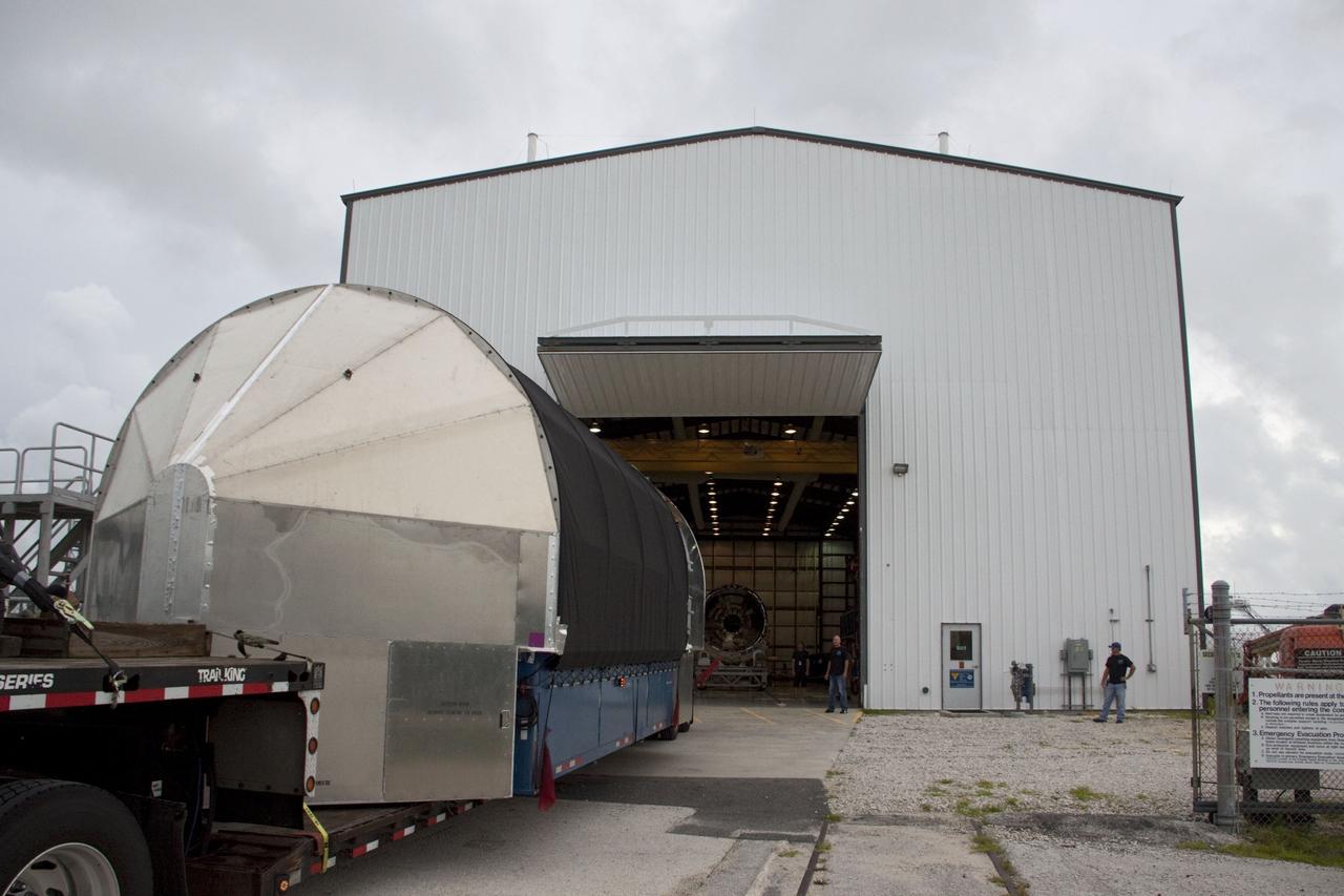CAPE CANAVERAL, Fla. -- The second stage for the Space Exploration Technologies Corp., or SpaceX, Falcon 9 rocket is delivered to the SpaceX hangar at Pad 40 at Cape Canaveral Air Force Station in Florida.             The Falcon 9 rocket will launch a second Dragon spacecraft, called Dragon C2, in late 2011. The mission will demonstrate proximity operations during an approach within six miles of the International Space Station. The company is building the Dragon to fly on resupply missions to the station. SpaceX was awarded procurement for three demonstration flights under the Commercial Orbital Transportation Services, or COTS, program managed by NASA's Johnson Space Center in Houston. The SpaceX contract provides for 12 missions to resupply the station from 2011 through 2015. Photo credit: NASA/Jim Grossmann