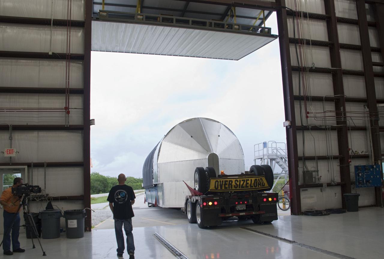 CAPE CANAVERAL, Fla. -- The second stage for the Space Exploration Technologies Corp., or SpaceX, Falcon 9 rocket is delivered to the SpaceX hangar at Pad 40 at Cape Canaveral Air Force Station in Florida.             The Falcon 9 rocket will launch a second Dragon spacecraft, called Dragon C2, in late 2011. The mission will demonstrate proximity operations during an approach within six miles of the International Space Station. The company is building the Dragon to fly on resupply missions to the station. SpaceX was awarded procurement for three demonstration flights under the Commercial Orbital Transportation Services, or COTS, program managed by NASA's Johnson Space Center in Houston. The SpaceX contract provides for 12 missions to resupply the station from 2011 through 2015. Photo credit: NASA/Jim Grossmann