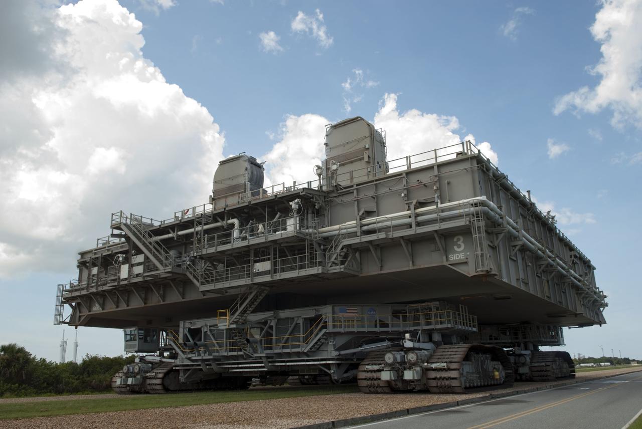CAPE CANAVERAL, Fla. -- At NASA's Kennedy Space Center in Florida, Mobile Launcher Platform-3 (MLP), which supported space shuttle Atlantis for its final flight to the International Space Station on the STS-135 mission, is making its last journey from Launch Pad 39A back to the Vehicle Assembly Building (VAB) atop a massive crawler-transporter. For more than 40 years, the MLPs have traveled between the VAB to both launch pads at Launch Complex 39, and then returned to the VAB for future use. MLP-3 was first used to launch Columbia on the STS-32 mission on Jan. 9, 1990. Photo credit: NASA/Jim Grossmann