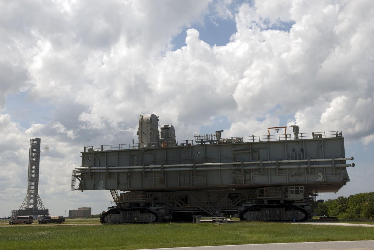 CAPE CANAVERAL, Fla. -- At NASA's Kennedy Space Center in Florida, Mobile Launcher Platform-3 (MLP), which supported space shuttle Atlantis for its final flight to the International Space Station on the STS-135 mission, is making its last journey atop a massive crawler-transporter from Launch Pad 39A into the Vehicle Assembly Building (VAB). For more than 40 years, the MLPs have traveled between the VAB to both launch pads at Launch Complex 39, and then returned to the VAB for future use. MLP-3 was first used to launch Columbia on the STS-32 mission on Jan. 9, 1990. Photo credit: NASA/Jim Grossmann