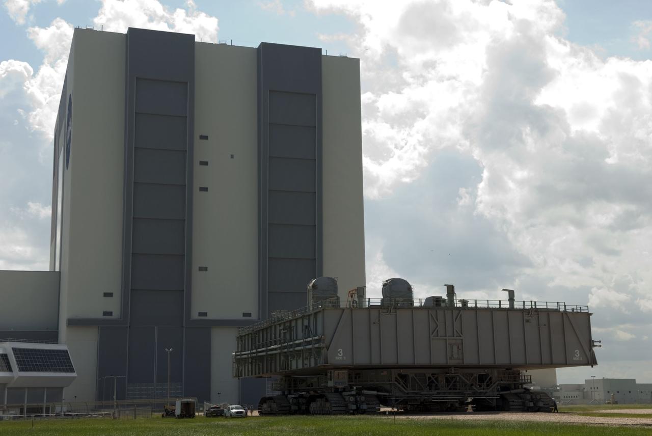 CAPE CANAVERAL, Fla. -- At NASA's Kennedy Space Center in Florida, Mobile Launcher Platform-3 (MLP), which supported space shuttle Atlantis for its final flight to the International Space Station on the STS-135 mission, is making its last journey from Launch Pad 39A into the Vehicle Assembly Building (VAB) atop a massive crawler-transporter. For more than 40 years, the MLPs have traveled between the VAB to both launch pads at Launch Complex 39, and then returned to the VAB for future use. MLP-3 was first used to launch Columbia on the STS-32 mission on Jan. 9, 1990. Photo credit: NASA/Jim Grossmann