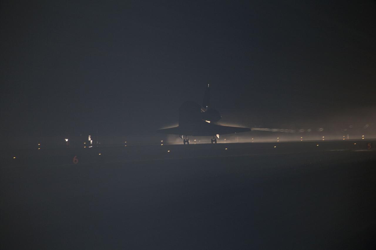 CAPE CANAVERAL, Fla. -- Xenon lights guide space shuttle Atlantis down on the Shuttle Landing Facility's Runway 15 at NASA's Kennedy Space Center in Florida for the final time. Securing the space shuttle fleet's place in history, Atlantis marked the 26th nighttime landing of NASA's Space Shuttle Program and the 78th landing at Kennedy. Main gear touchdown was at 5:57:00 a.m. EDT, followed by nose gear touchdown at 5:57:20 a.m., and wheelstop at 5:57:54 a.m. On board are STS-135 Commander Chris Ferguson, Pilot Doug Hurley, and Mission Specialists Sandra Magnus and Rex Walheim.      On the 37th shuttle mission to the International Space Station, STS-135 delivered more than 9,400 pounds of spare parts, equipment and supplies in the Raffaello multi-purpose logistics module that will sustain station operations for the next year. STS-135 was the 33rd and final flight for Atlantis, which has spent 307 days in space, orbited Earth 4,848 times and traveled 125,935,769 miles. For more information visit, www.nasa.gov/mission_pages/shuttle/shuttlemissions/sts135/index.html. Photo credit: NASA/Frank Michaux