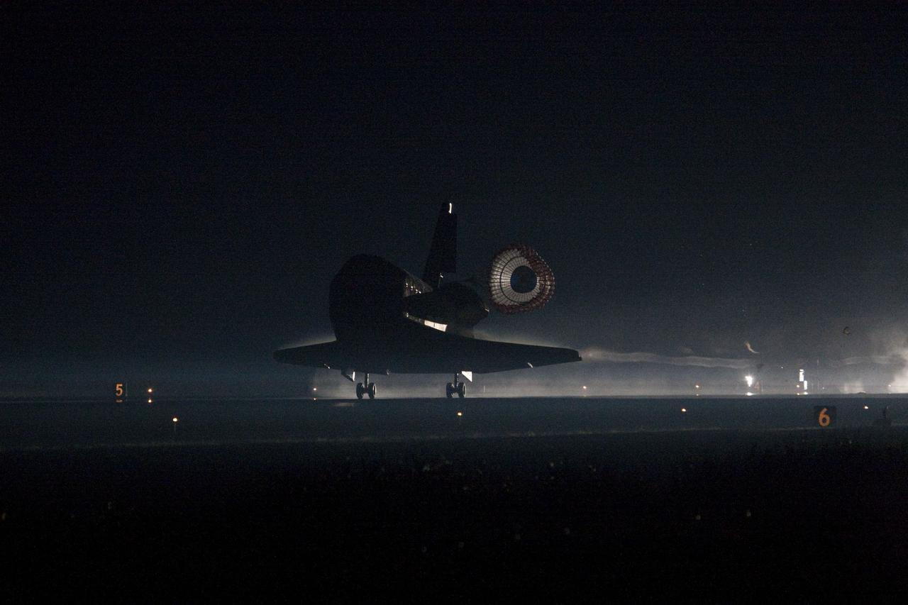 CAPE CANAVERAL, Fla. -- Space shuttle Atlantis returns to Earth for the last time on Runway 15 at NASA's Kennedy Space Center in Florida just before sunrise. Atlantis touched down on Runway 15 at 5:57 a.m., bringing an end to the STS-135 mission and NASA's Space Shuttle Program.             On the 37th shuttle mission to the International Space Station, STS-135 delivered more than 9,400 pounds of spare parts, equipment and supplies in the Raffaello multi-purpose logistics module that will sustain station operations for the next year. STS-135 was the 33rd and final flight for Atlantis, which has spent 307 days in space, orbited Earth 4,848 times and traveled 125,935,769 miles. For more information visit, www.nasa.gov/mission_pages/shuttle/shuttlemissions/sts135/index.html. Photo credit: NASA/Tony Gray