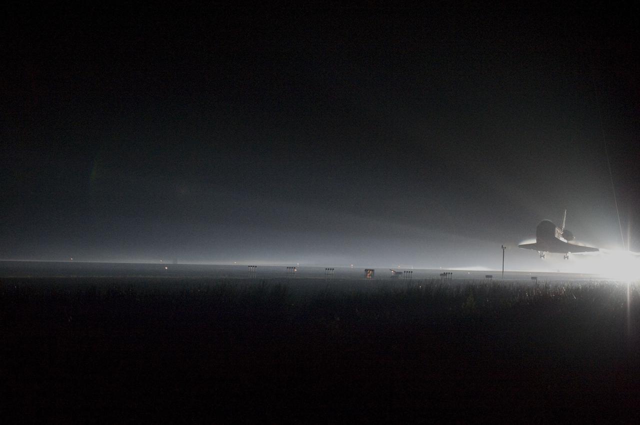 CAPE CANAVERAL, Fla. -- Space shuttle Atlantis returns to Earth for the last time on Runway 15 at NASA's Kennedy Space Center in Florida just before sunrise. Atlantis touched down on Runway 15 at 5:57 a.m., bringing an end to the STS-135 mission and NASA's Space Shuttle Program.           CAPE CANAVERAL, Fla. -- Xenons cast a halo of light on space shuttle Atlantis as the spacecraft approaches Runway 15 at NASA's Kennedy Space Center in Florida for the last time. Securing the space shuttle fleet's place in history, Atlantis marked the 26th nighttime landing of NASA's Space Shuttle Program and the 78th landing at Kennedy. Main gear touchdown was at 5:57:00 a.m. EDT, followed by nose gear touchdown at 5:57:20 a.m., and wheelstop at 5:57:54 a.m. On board are STS-135 Commander Chris Ferguson, Pilot Doug Hurley, and Mission Specialists Sandra Magnus and Rex Walheim.          On the 37th shuttle mission to the International Space Station, STS-135 delivered more than 9,400 pounds of spare parts, equipment and supplies in the Raffaello multi-purpose logistics module that will sustain station operations for the next year. STS-135 was the 33rd and final flight for Atlantis, which has spent 307 days in space, orbited Earth 4,848 times and traveled 125,935,769 miles. For more information visit, www.nasa.gov/mission_pages/shuttle/shuttlemissions/sts135/index.html. Photo credit: NASA/Carl Winebarger
