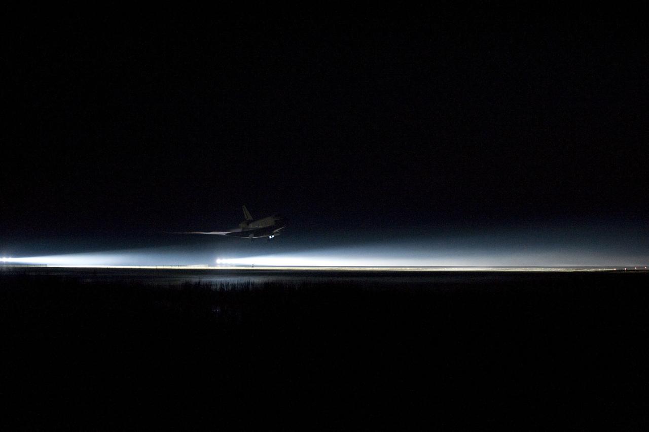 CAPE CANAVERAL, Fla. -- Xenons light the way home for space shuttle Atlantis at NASA's Kennedy Space Center in Florida for the final time. Securing the space shuttle fleet's place in history, Atlantis marked the 26th nighttime landing of NASA's Space Shuttle Program and the 78th landing at Kennedy. Main gear touchdown on the Shuttle Landing Facility's Runway 15 was at 5:57:00 a.m. EDT, followed by nose gear touchdown at 5:57:20 a.m., and wheelstop at 5:57:54 a.m. On board are STS-135 Commander Chris Ferguson, Pilot Doug Hurley, and Mission Specialists Sandra Magnus and Rex Walheim.          On the 37th shuttle mission to the International Space Station, STS-135 delivered more than 9,400 pounds of spare parts, equipment and supplies in the Raffaello multi-purpose logistics module that will sustain station operations for the next year. STS-135 was the 33rd and final flight for Atlantis, which has spent 307 days in space, orbited Earth 4,848 times and traveled 125,935,769 miles. For more information visit, www.nasa.gov/mission_pages/shuttle/shuttlemissions/sts135/index.html. Photo credit: NASA/Sandra Joseph