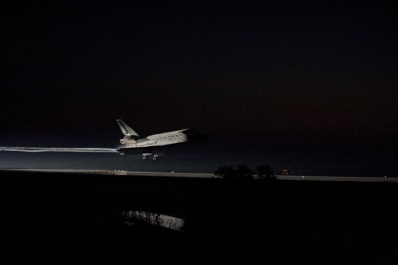 CAPE CANAVERAL, Fla. -- Xenons light the way home as space shuttle Atlantis' iconic white frame appears over the Shuttle Landing Facility's Runway 15 at NASA's Kennedy Space Center in Florida for the last time. Securing the space shuttle fleet's place in history, Atlantis marked the 26th nighttime landing of NASA's Space Shuttle Program and the 78th landing at Kennedy. Main gear touchdown was at 5:57:00 a.m. EDT, followed by nose gear touchdown at 5:57:20 a.m., and wheelstop at 5:57:54 a.m. On board are STS-135 Commander Chris Ferguson, Pilot Doug Hurley, and Mission Specialists Sandra Magnus and Rex Walheim.                On the 37th shuttle mission to the International Space Station, STS-135 delivered more than 9,400 pounds of spare parts, equipment and supplies in the Raffaello multi-purpose logistics module that will sustain station operations for the next year. STS-135 was the 33rd and final flight for Atlantis, which has spent 307 days in space, orbited Earth 4,848 times and traveled 125,935,769 miles. For more information visit, www.nasa.gov/mission_pages/shuttle/shuttlemissions/sts135/index.html. Photo credit: NASA/Sandra Joseph