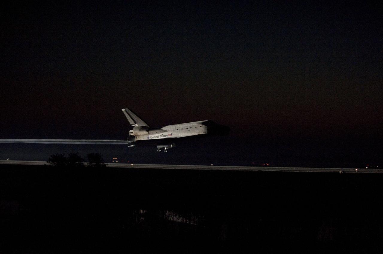 CAPE CANAVERAL, Fla. -- Space shuttle Atlantis' bright-white, iconic frame illuminates the darkness as it touches down on the Shuttle Landing Facility's Runway 15 at NASA's Kennedy Space Center in Florida for the final time. Securing the space shuttle fleet's place in history, Atlantis marked the 26th nighttime landing of NASA's Space Shuttle Program and the 78th landing at Kennedy. Main gear touchdown was at 5:57:00 a.m. EDT, followed by nose gear touchdown at 5:57:20 a.m., and wheelstop at 5:57:54 a.m. On board are STS-135 Commander Chris Ferguson, Pilot Doug Hurley, and Mission Specialists Sandra Magnus and Rex Walheim.              On the 37th shuttle mission to the International Space Station, STS-135 delivered more than 9,400 pounds of spare parts, equipment and supplies in the Raffaello multi-purpose logistics module that will sustain station operations for the next year. STS-135 was the 33rd and final flight for Atlantis, which has spent 307 days in space, orbited Earth 4,848 times and traveled 125,935,769 miles. For more information visit, www.nasa.gov/mission_pages/shuttle/shuttlemissions/sts135/index.html. Photo credit: NASA/Sandra Joseph