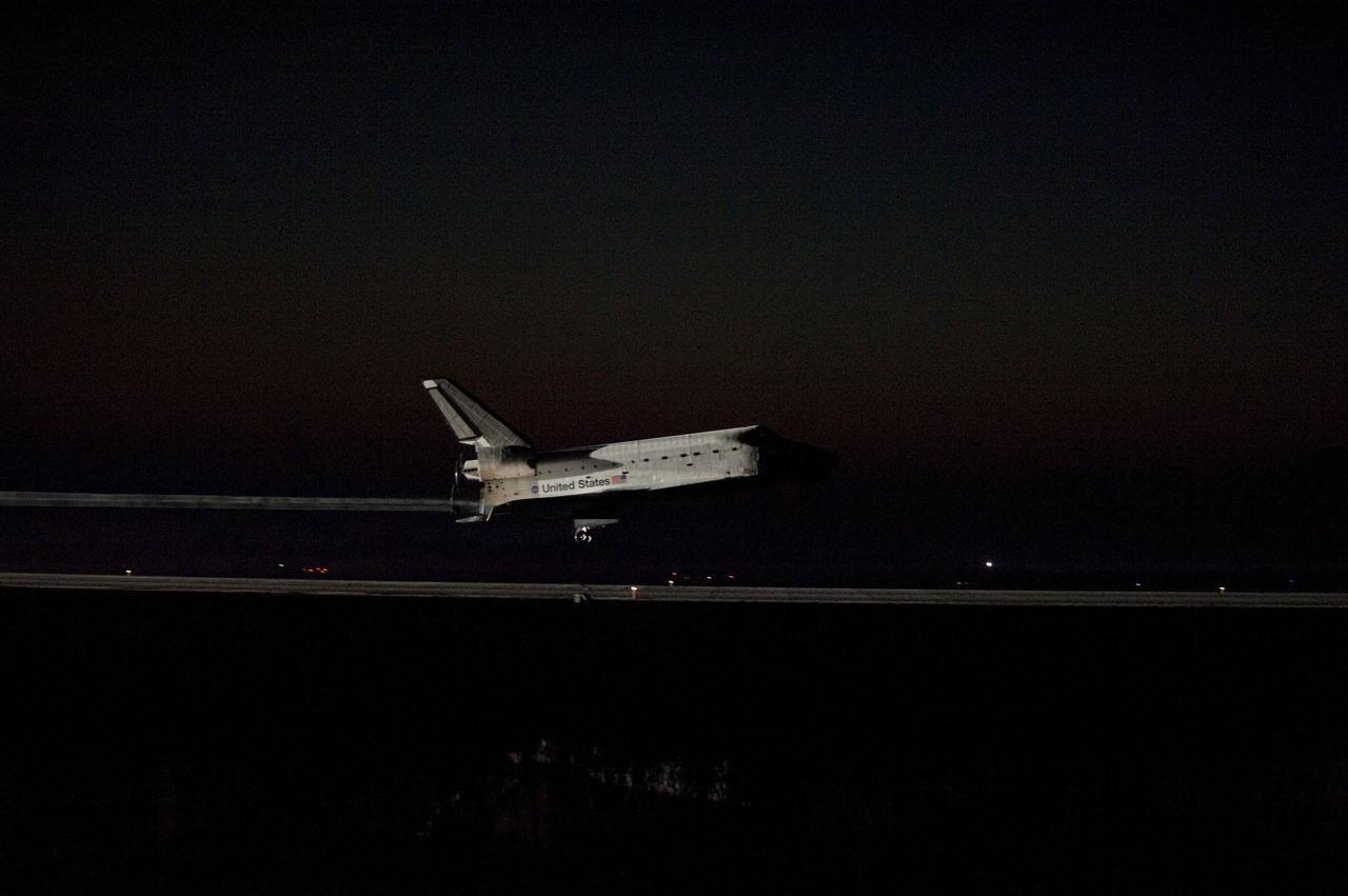 CAPE CANAVERAL, Fla. -- Space shuttle Atlantis' bright-white, iconic frame illuminates the darkness as it touches down on the Shuttle Landing Facility's Runway 15 at NASA's Kennedy Space Center in Florida for the final time. Securing the space shuttle fleet's place in history, Atlantis marked the 26th nighttime landing of NASA's Space Shuttle Program and the 78th landing at Kennedy. Main gear touchdown was at 5:57:00 a.m. EDT, followed by nose gear touchdown at 5:57:20 a.m., and wheelstop at 5:57:54 a.m. On board are STS-135 Commander Chris Ferguson, Pilot Doug Hurley, and Mission Specialists Sandra Magnus and Rex Walheim.              On the 37th shuttle mission to the International Space Station, STS-135 delivered more than 9,400 pounds of spare parts, equipment and supplies in the Raffaello multi-purpose logistics module that will sustain station operations for the next year. STS-135 was the 33rd and final flight for Atlantis, which has spent 307 days in space, orbited Earth 4,848 times and traveled 125,935,769 miles. For more information visit, www.nasa.gov/mission_pages/shuttle/shuttlemissions/sts135/index.html. Photo credit: NASA/Sandra Joseph
