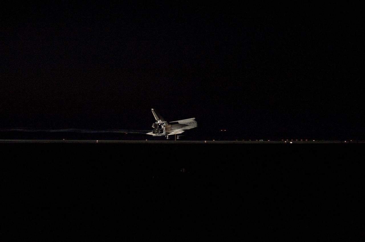 CAPE CANAVERAL, Fla. -- Space shuttle Atlantis' bright-white, iconic frame illuminates the darkness as it touches down on the Shuttle Landing Facility's Runway 15 at NASA's Kennedy Space Center in Florida for the final time. Securing the space shuttle fleet's place in history, Atlantis marked the 26th nighttime landing of NASA's Space Shuttle Program and the 78th landing at Kennedy. Main gear touchdown was at 5:57:00 a.m. EDT, followed by nose gear touchdown at 5:57:20 a.m., and wheelstop at 5:57:54 a.m. On board are STS-135 Commander Chris Ferguson, Pilot Doug Hurley, and Mission Specialists Sandra Magnus and Rex Walheim.              On the 37th shuttle mission to the International Space Station, STS-135 delivered more than 9,400 pounds of spare parts, equipment and supplies in the Raffaello multi-purpose logistics module that will sustain station operations for the next year. STS-135 was the 33rd and final flight for Atlantis, which has spent 307 days in space, orbited Earth 4,848 times and traveled 125,935,769 miles. For more information visit, www.nasa.gov/mission_pages/shuttle/shuttlemissions/sts135/index.html. Photo credit: NASA/Sandra Joseph